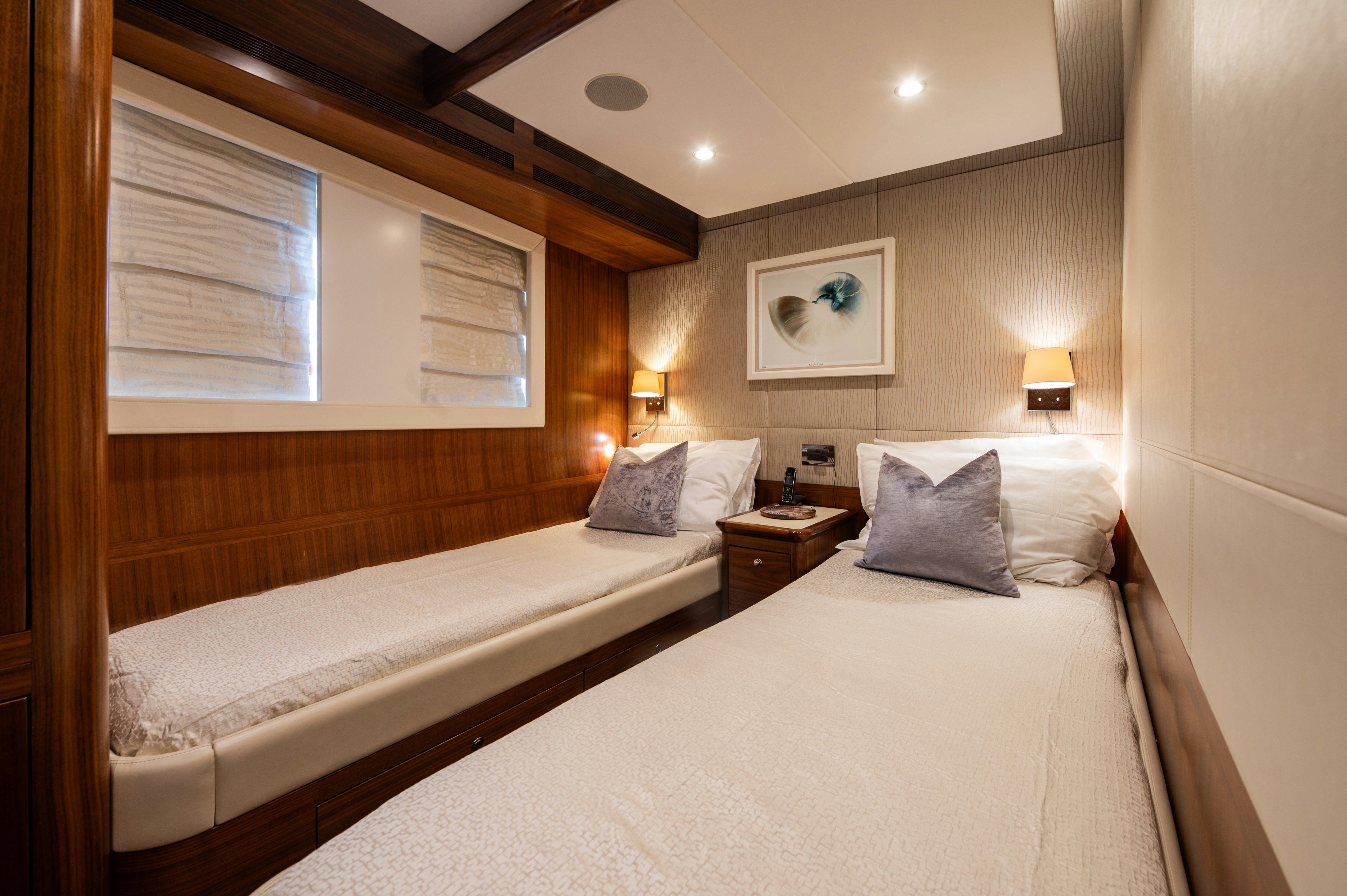a room with two beds aboard FIREFLY Yacht for Sale