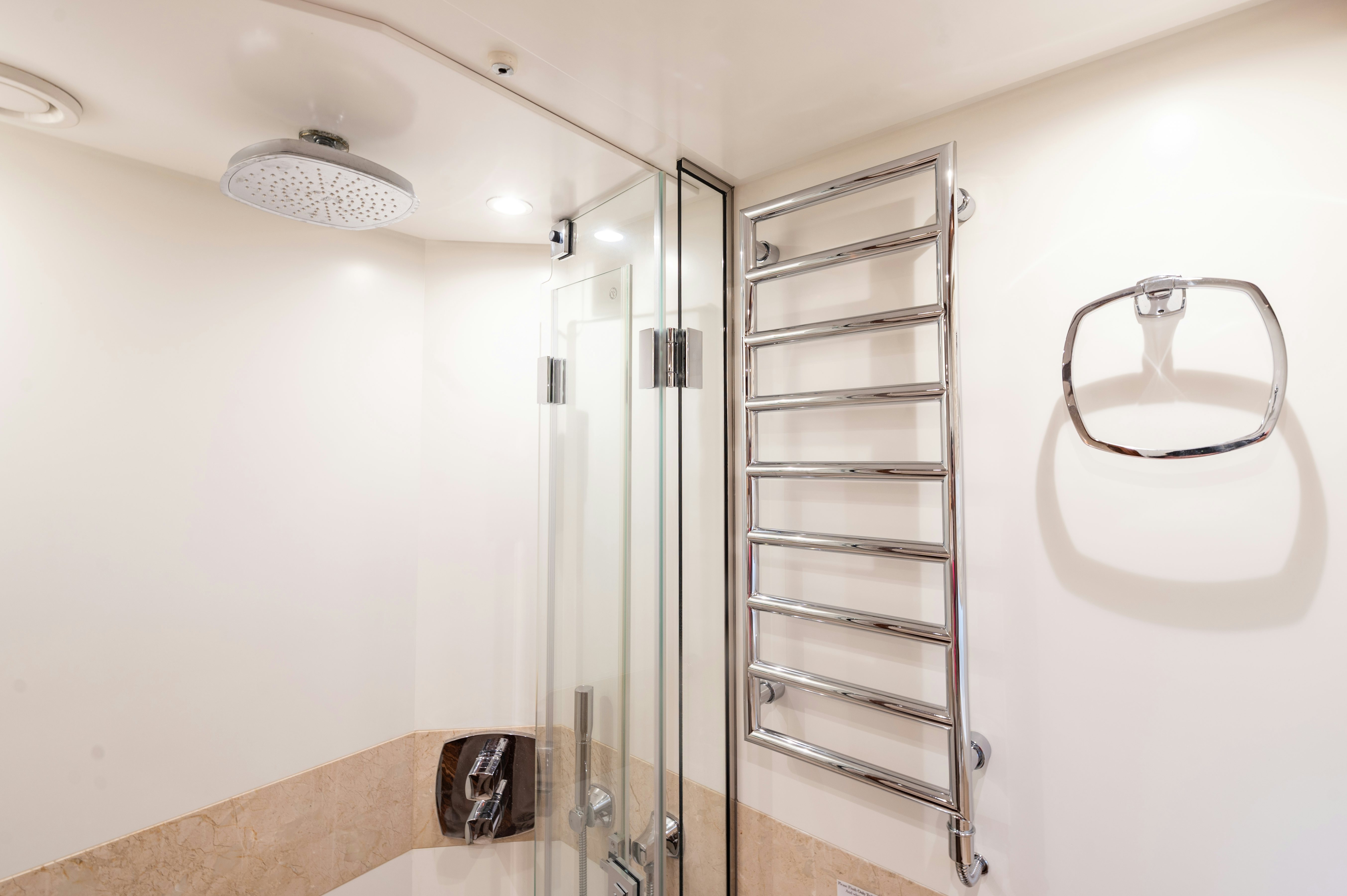 a bathroom with a glass shower unit aboard FIREFLY Yacht for Sale