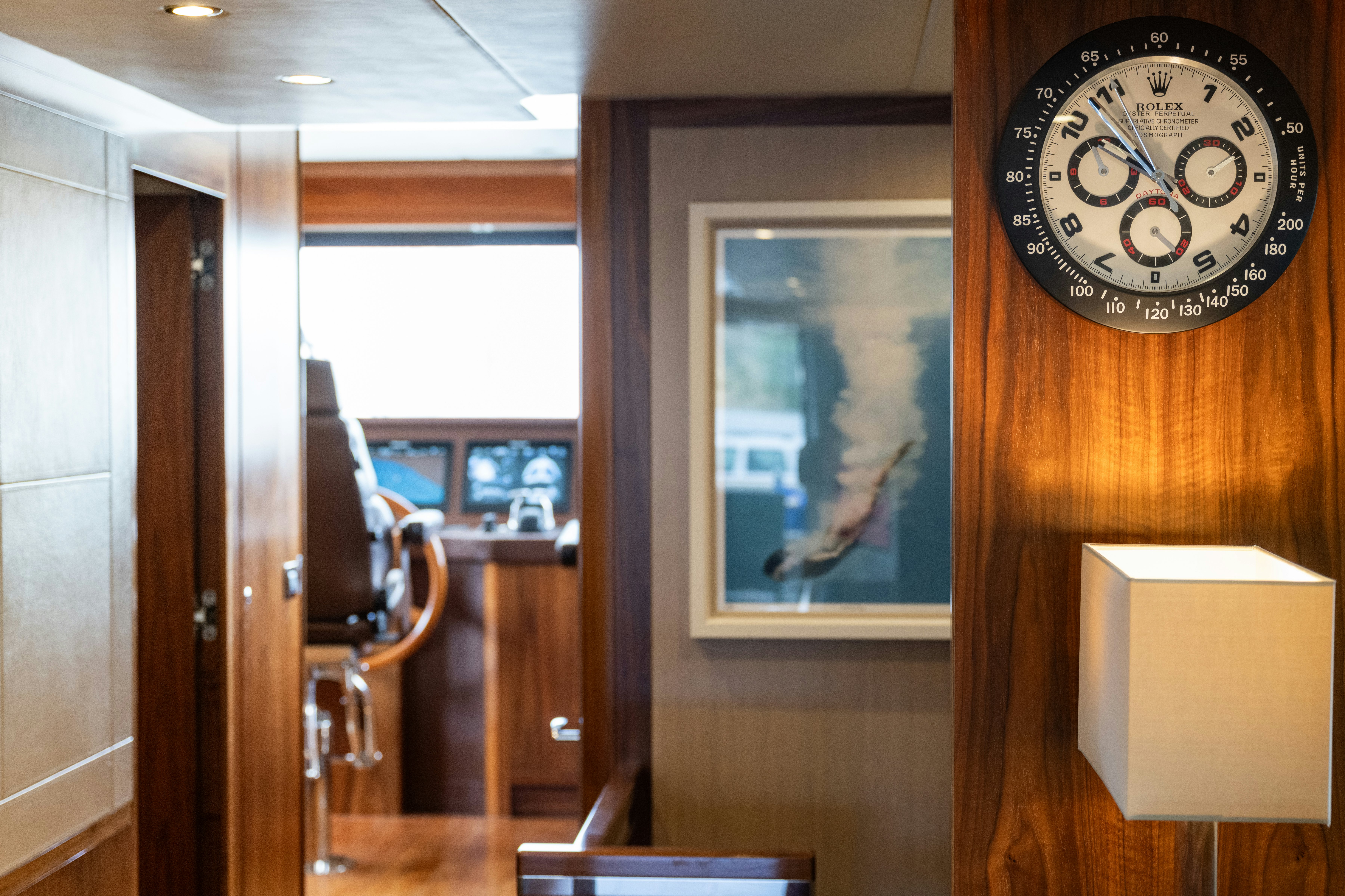 a clock on a wall aboard FIREFLY Yacht for Sale