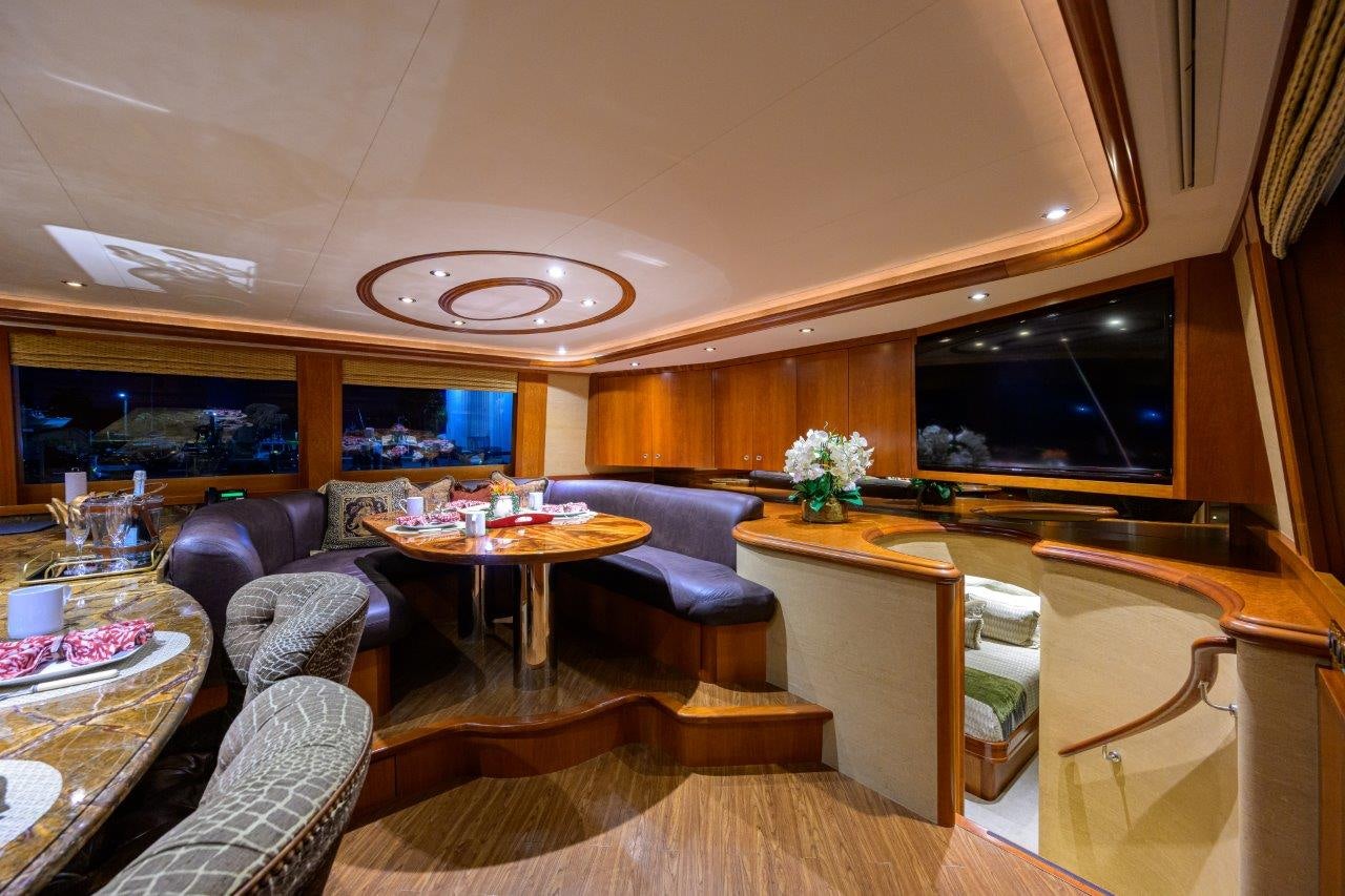 a living room with a large television aboard EXODUS Yacht for Sale