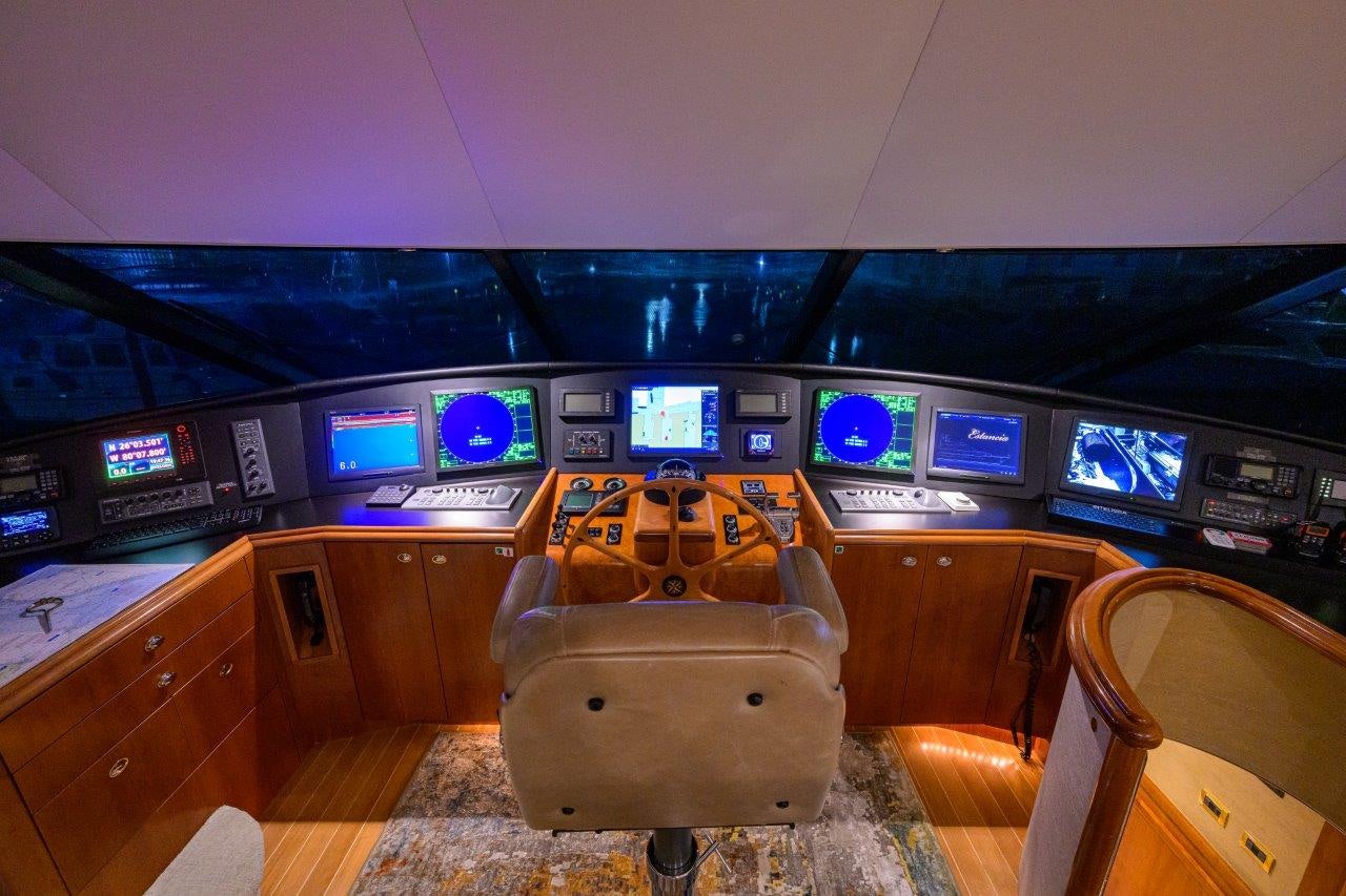 a room with a desk and chairs aboard EXODUS Yacht for Sale