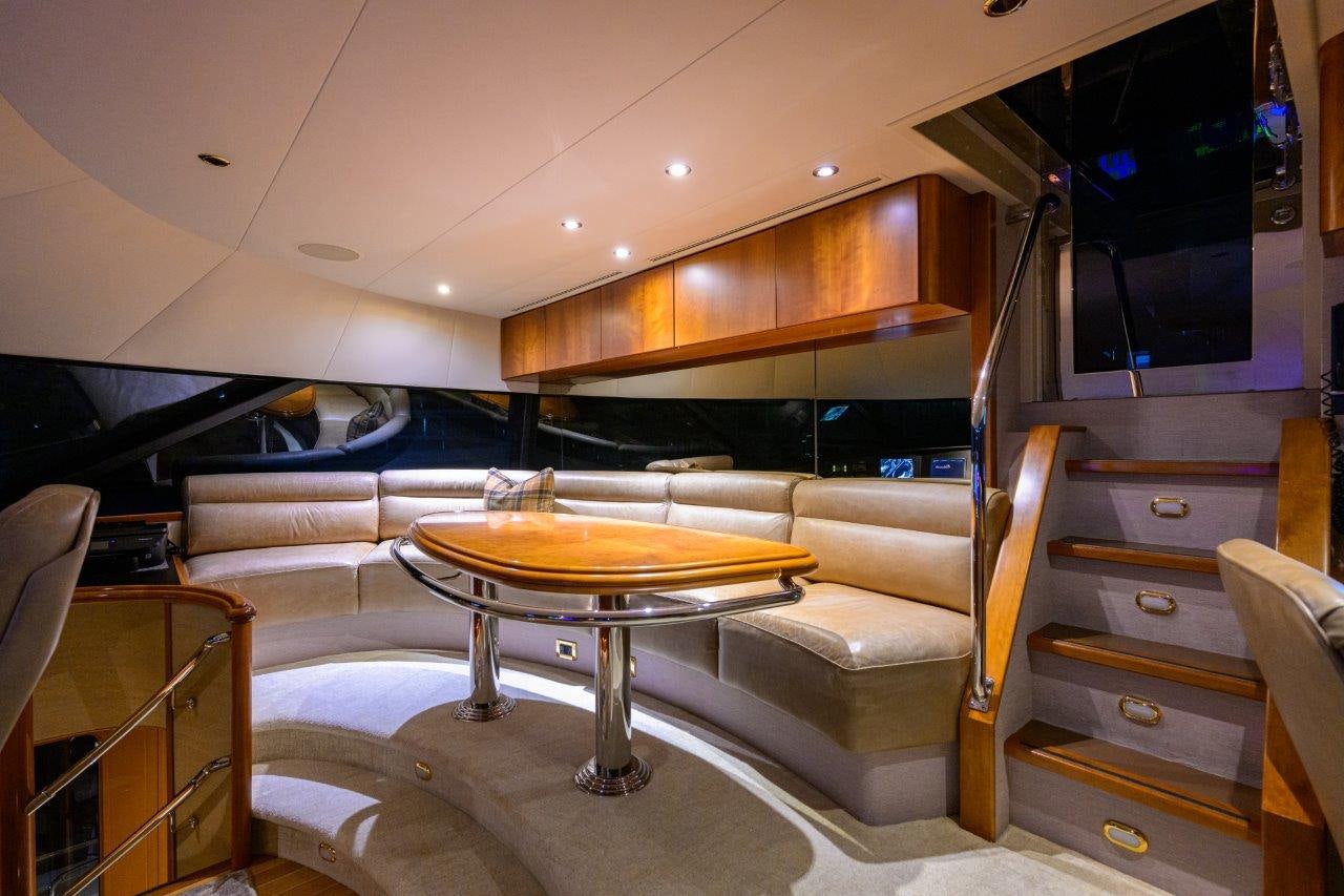 a room with a couch and a table aboard EXODUS Yacht for Sale