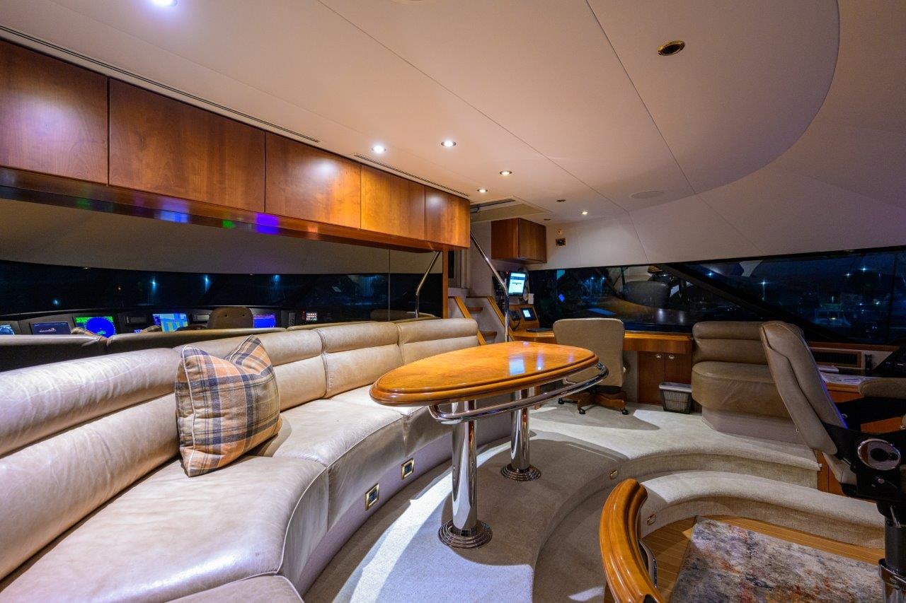 a living room with a couch and a television aboard EXODUS Yacht for Sale