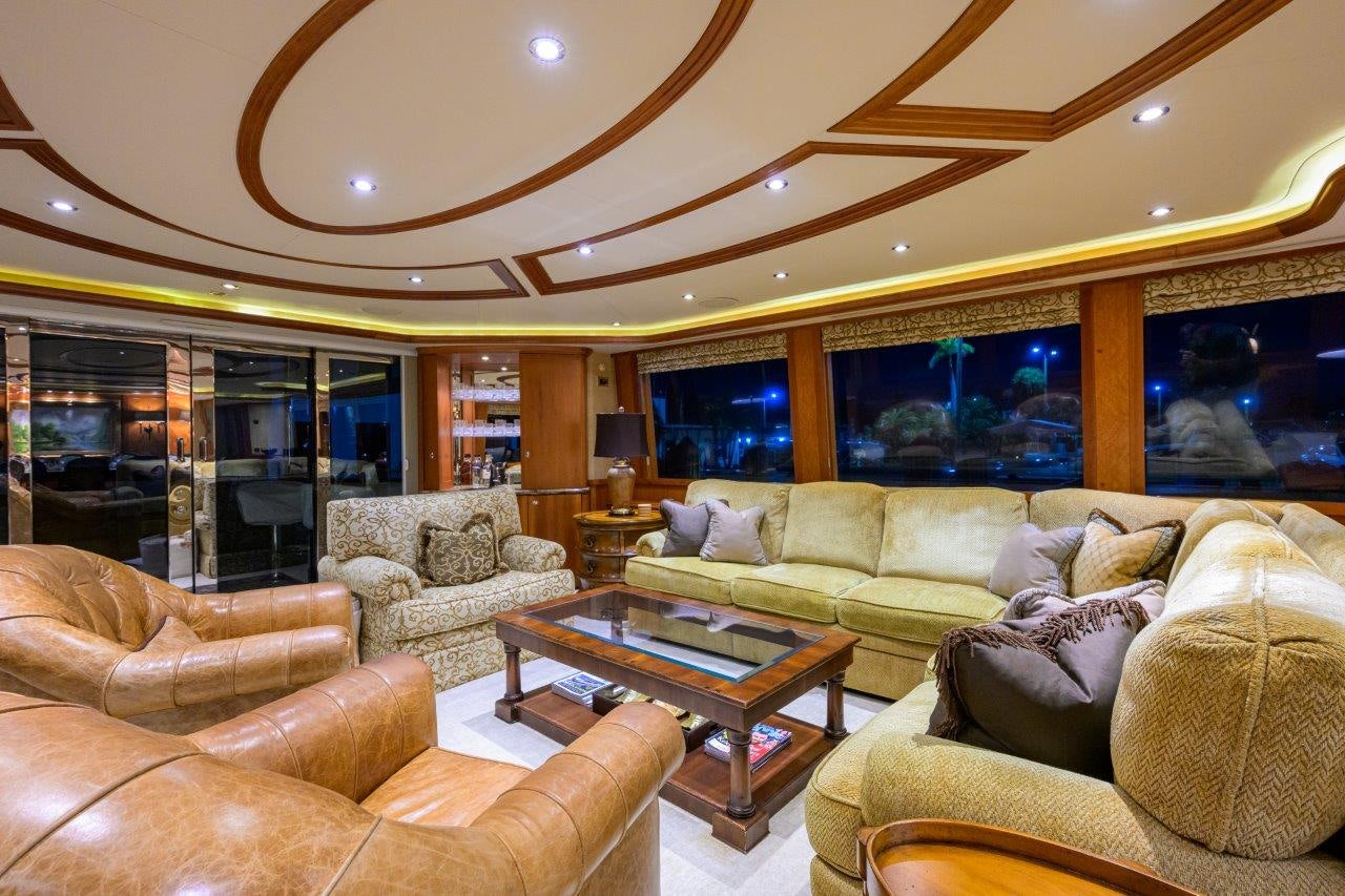 a living room with a large window aboard EXODUS Yacht for Sale
