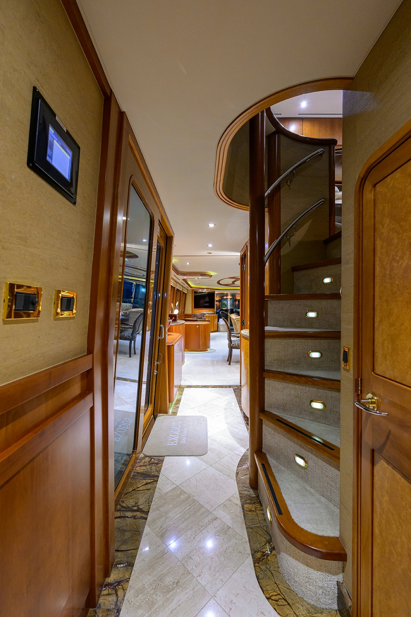 a hallway with a glass door aboard EXODUS Yacht for Sale