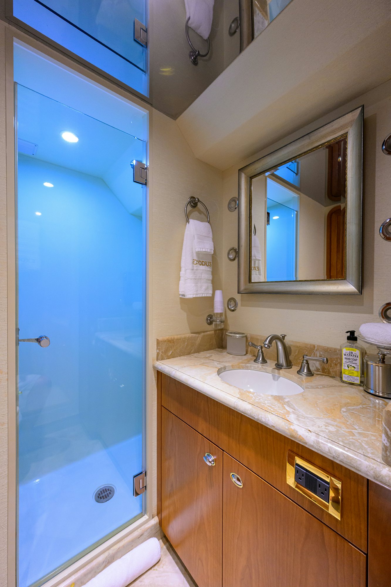 a bathroom with a sink and a mirror aboard EXODUS Yacht for Sale