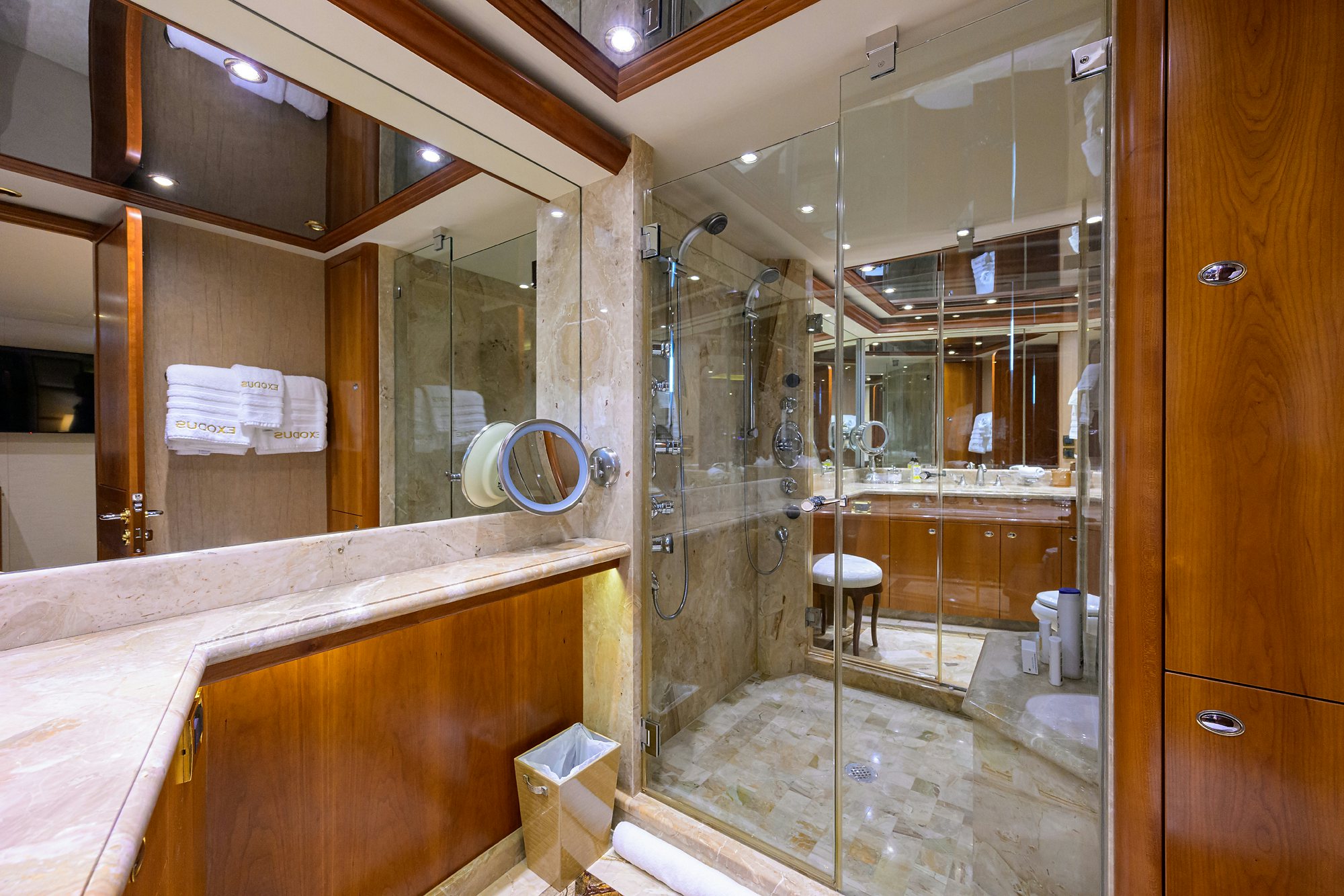 a bathroom with a glass shower aboard EXODUS Yacht for Sale