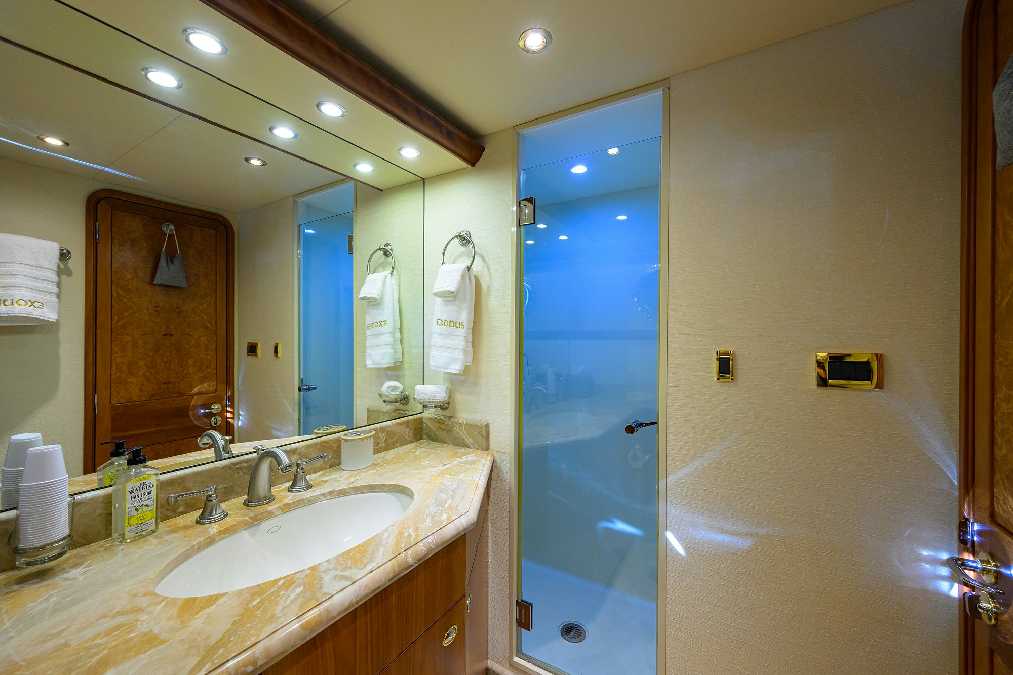 a bathroom with a sink and a shower aboard EXODUS Yacht for Sale