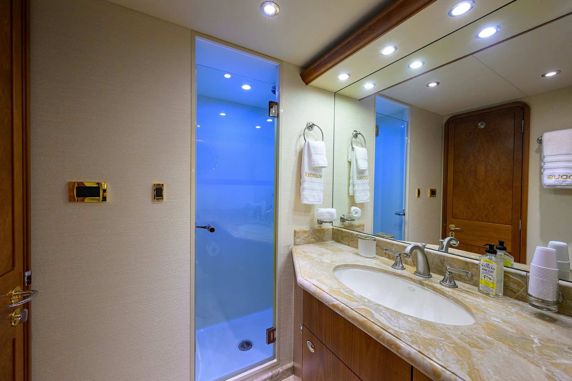 a bathroom with a large mirror aboard EXODUS Yacht for Sale