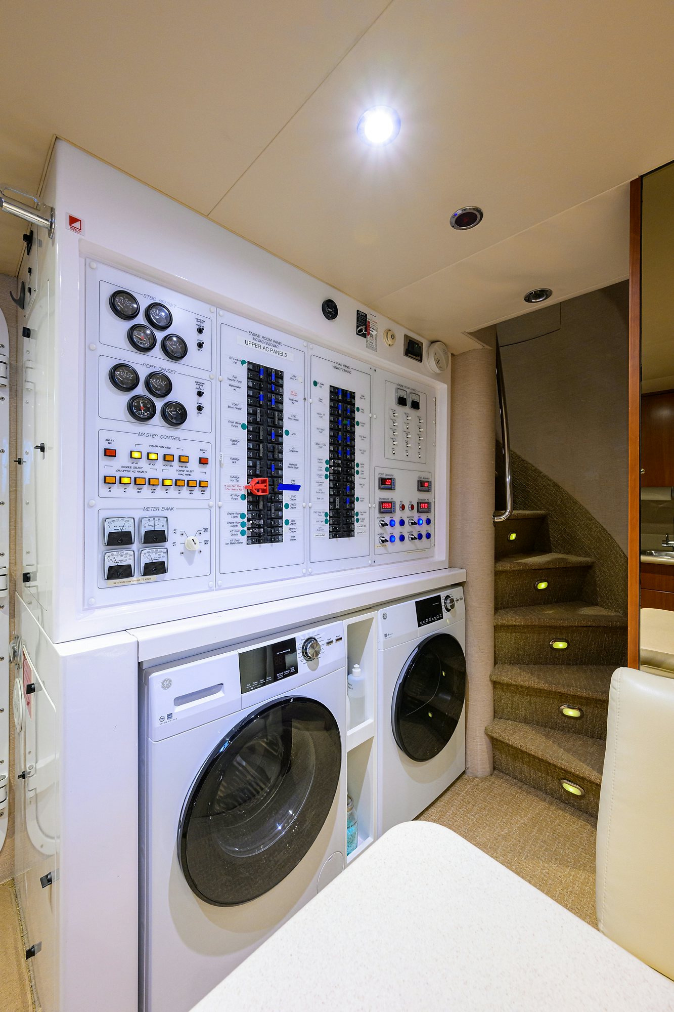 a washing machine in a room aboard EXODUS Yacht for Sale