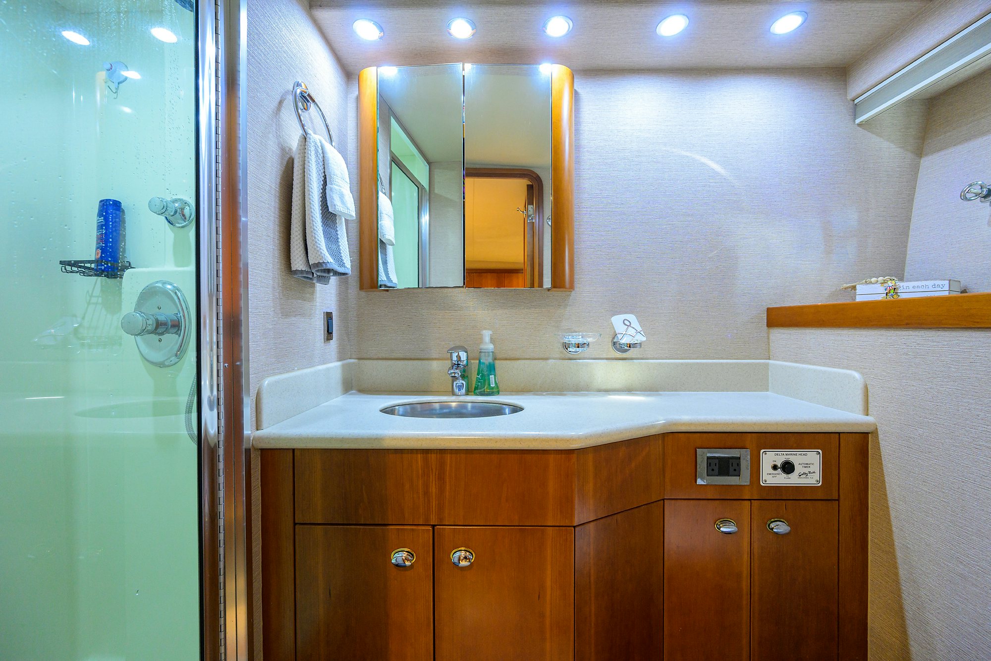 a bathroom with a sink and a mirror aboard EXODUS Yacht for Sale