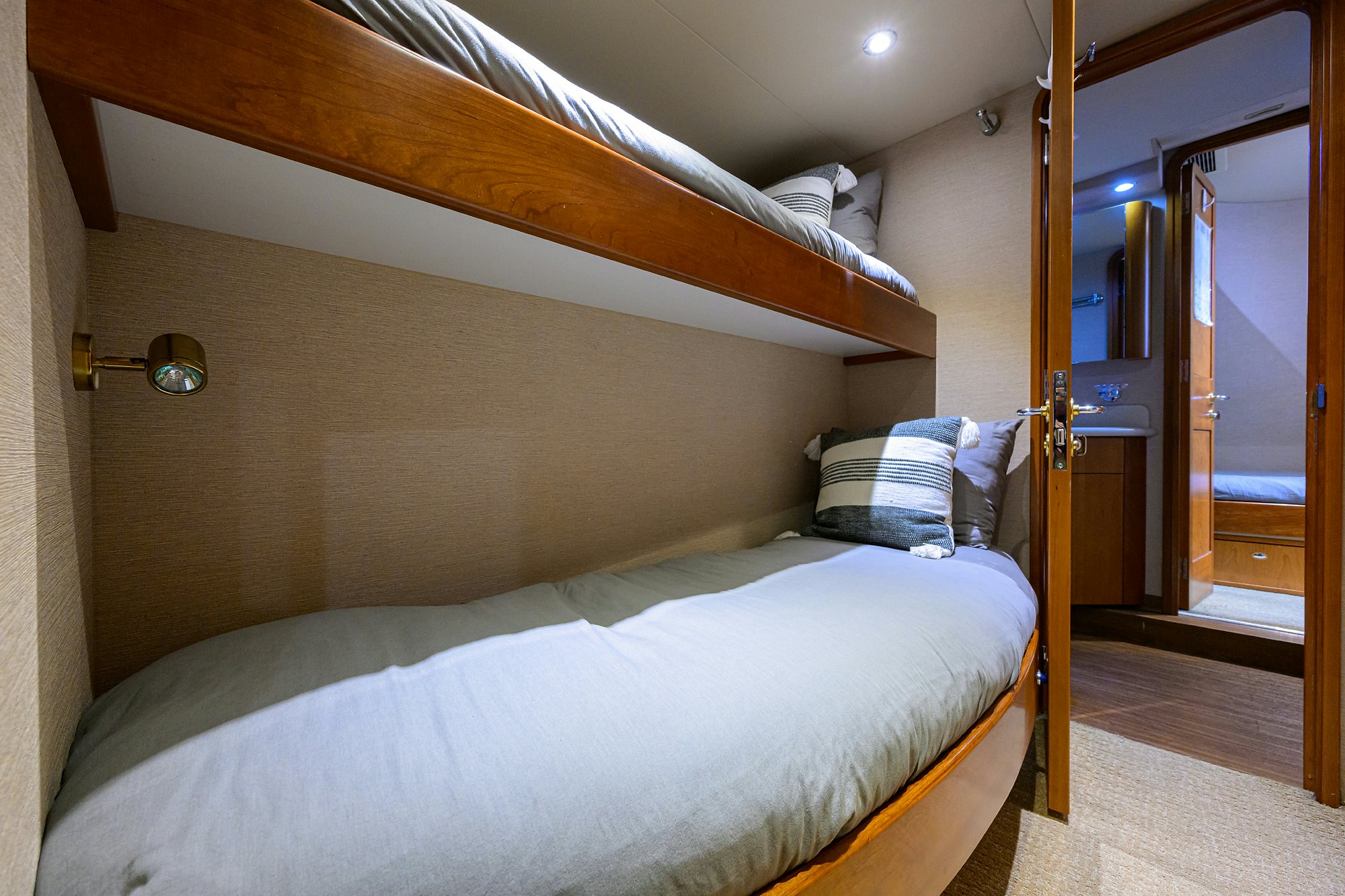 a bed with a white sheet aboard EXODUS Yacht for Sale