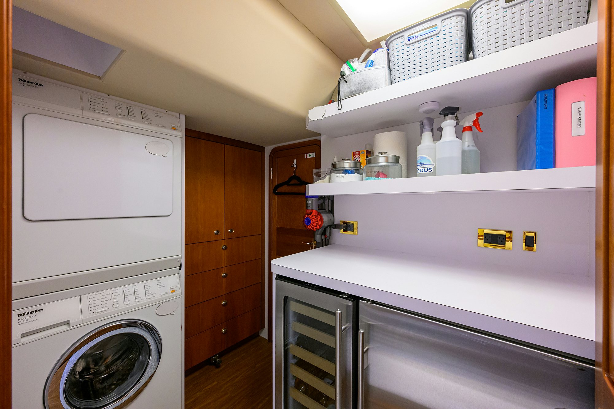 a kitchen with a washer and dryer aboard EXODUS Yacht for Sale