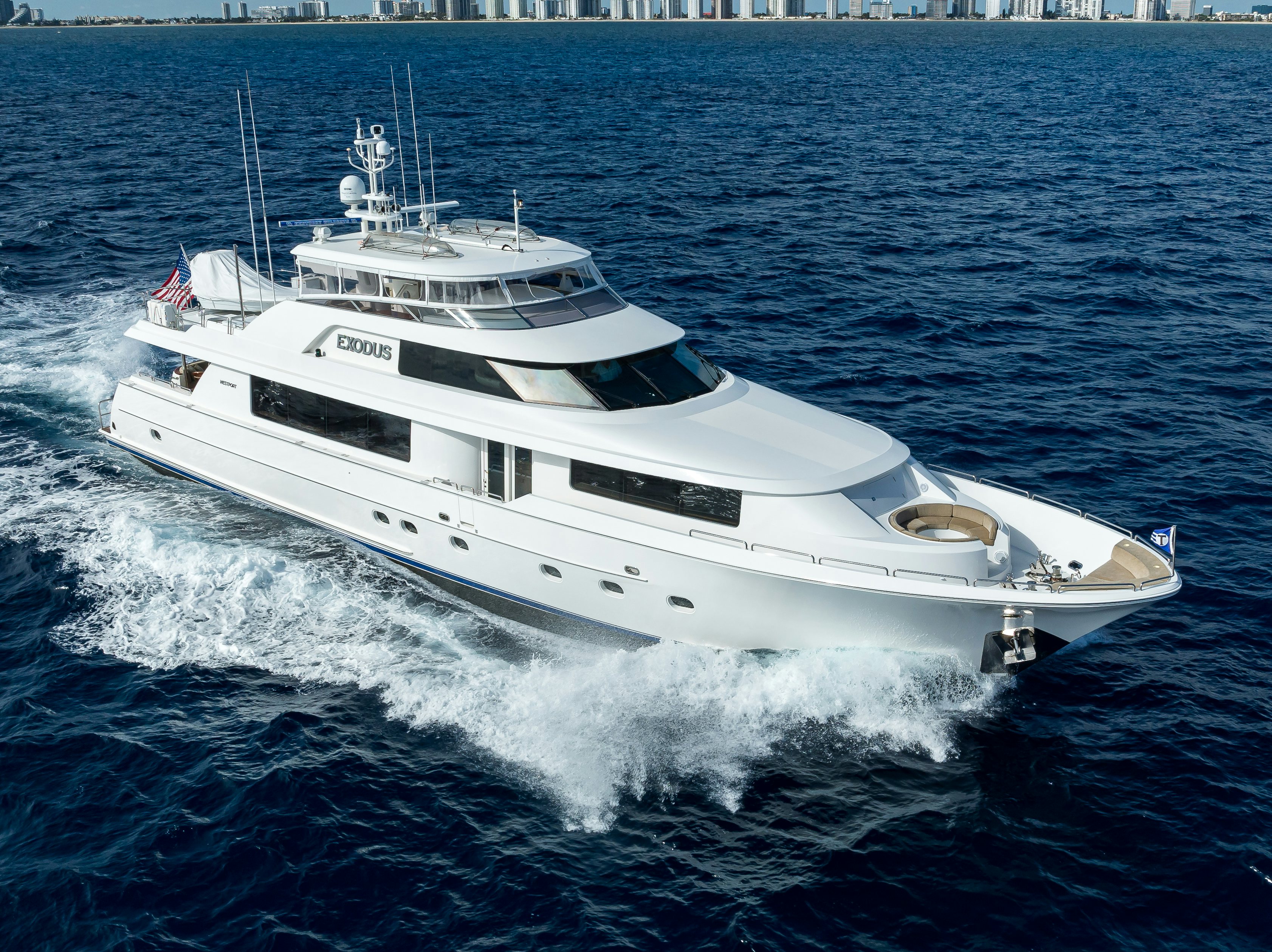 a white yacht on the water aboard EXODUS Yacht for Sale
