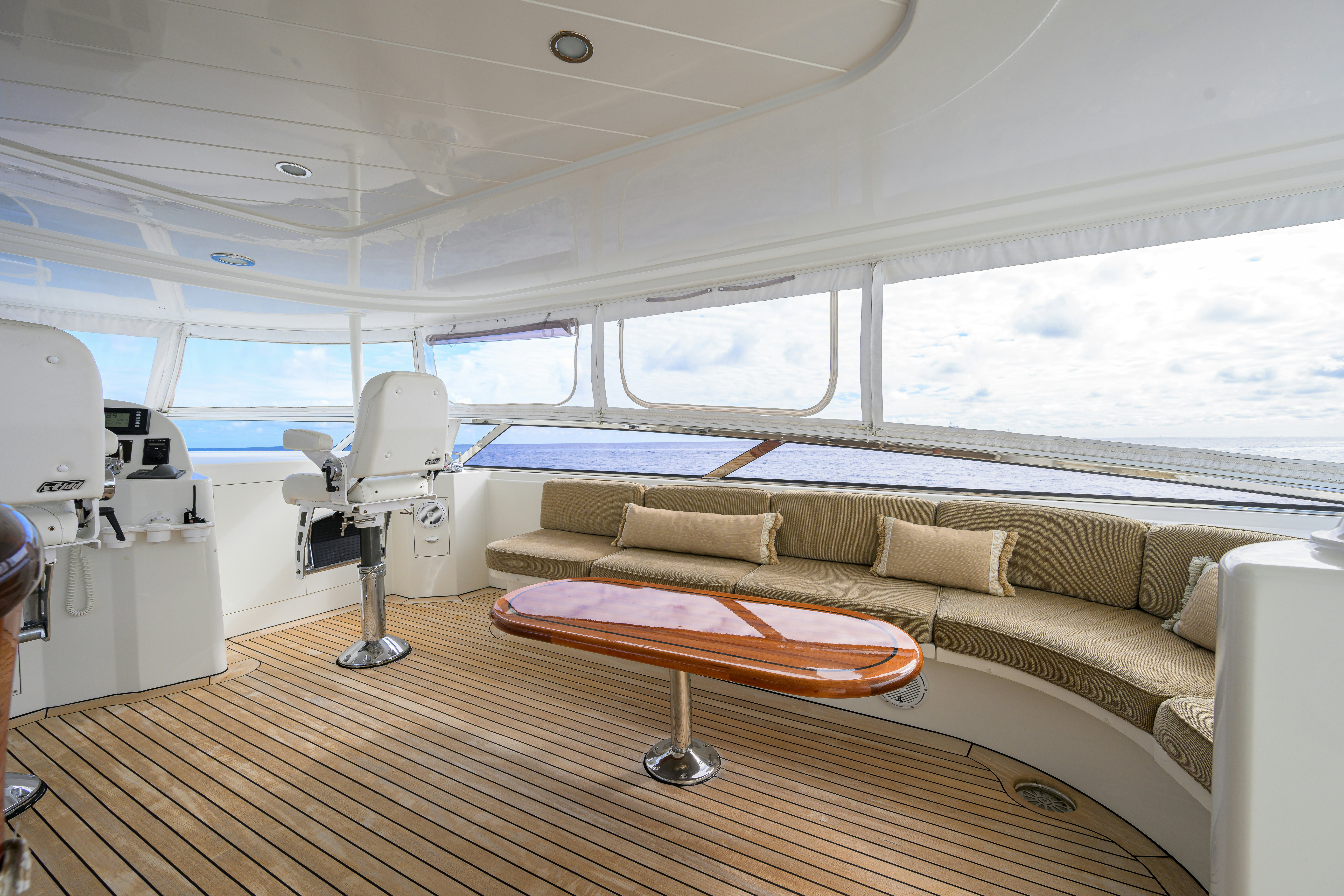 a living room with a large window aboard EXODUS Yacht for Sale