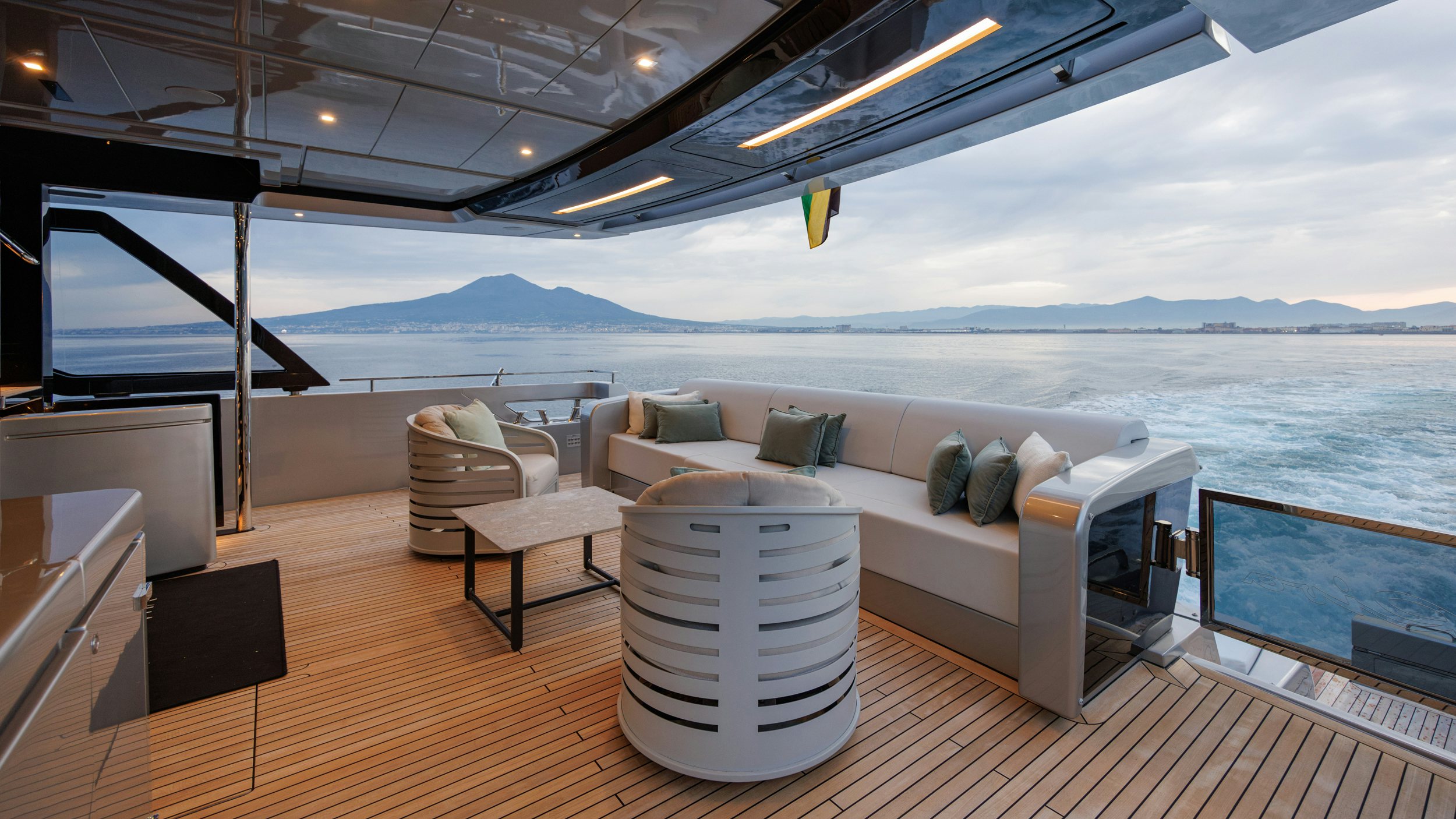 a room with a couch and a table and a large body of water aboard STILE DI VITA Yacht for Sale