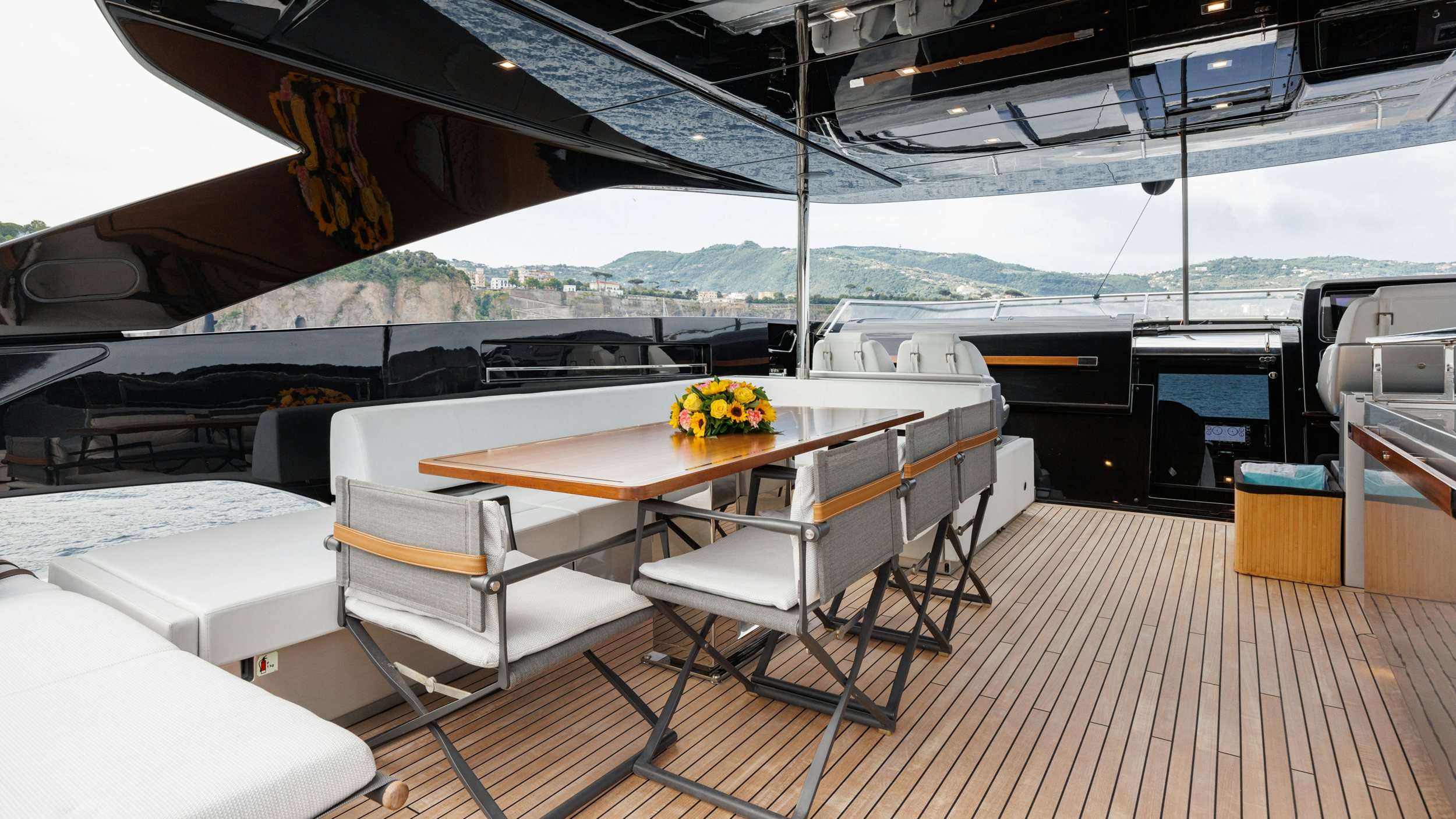 a table and chairs on a deck aboard STILE DI VITA Yacht for Sale