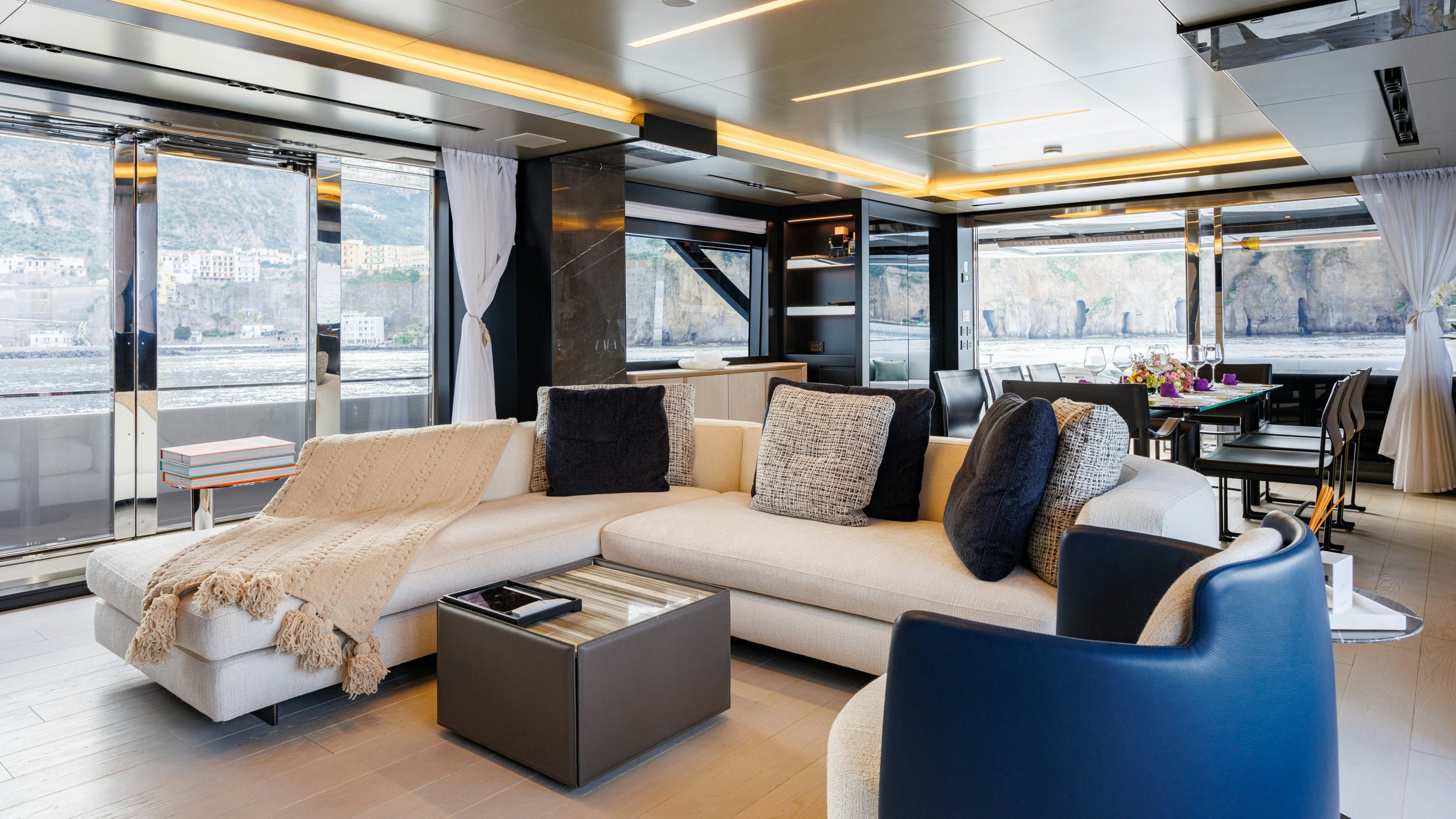a living room with a large window aboard STILE DI VITA Yacht for Sale