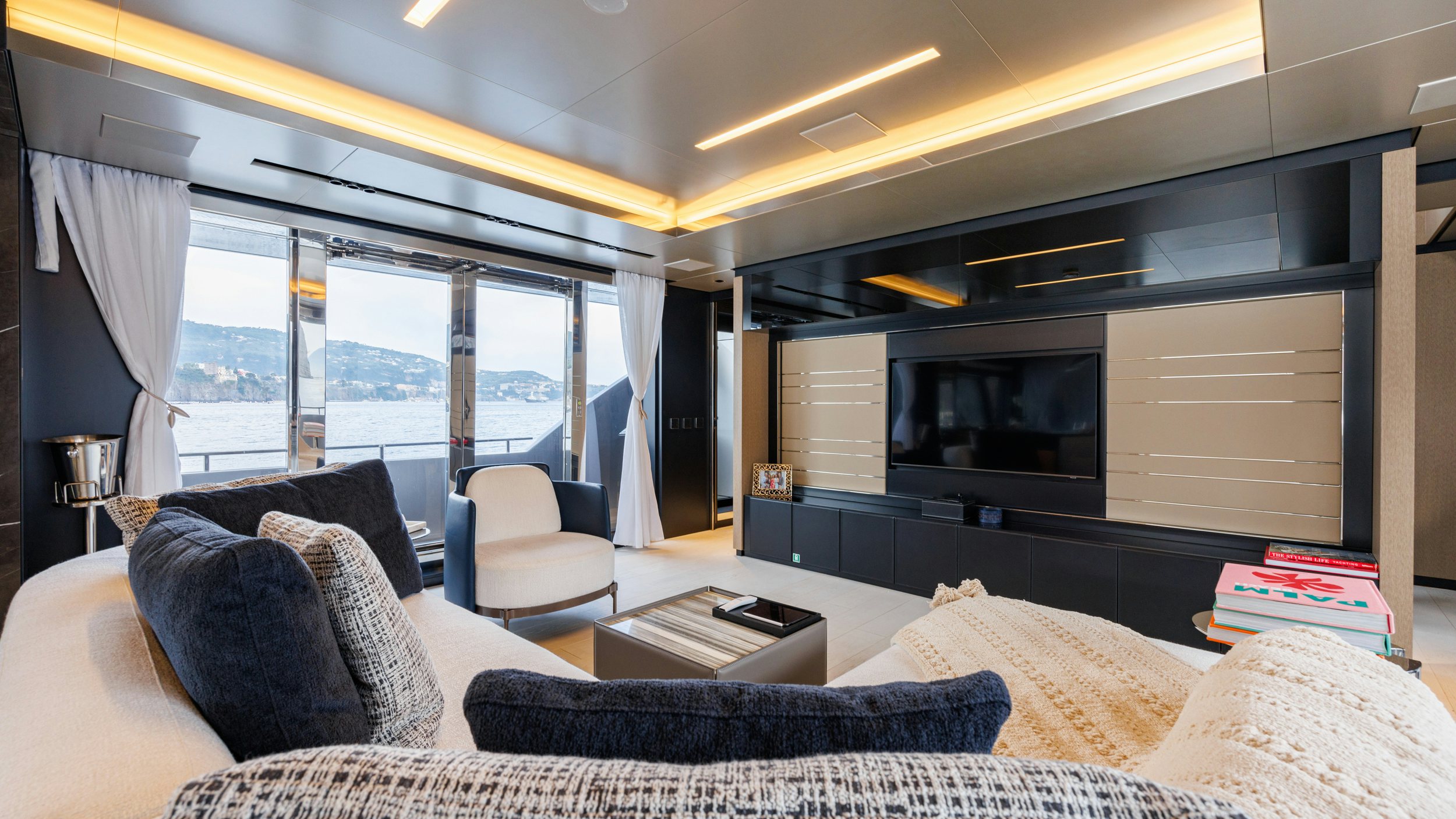 a living room with a large window aboard STILE DI VITA Yacht for Sale