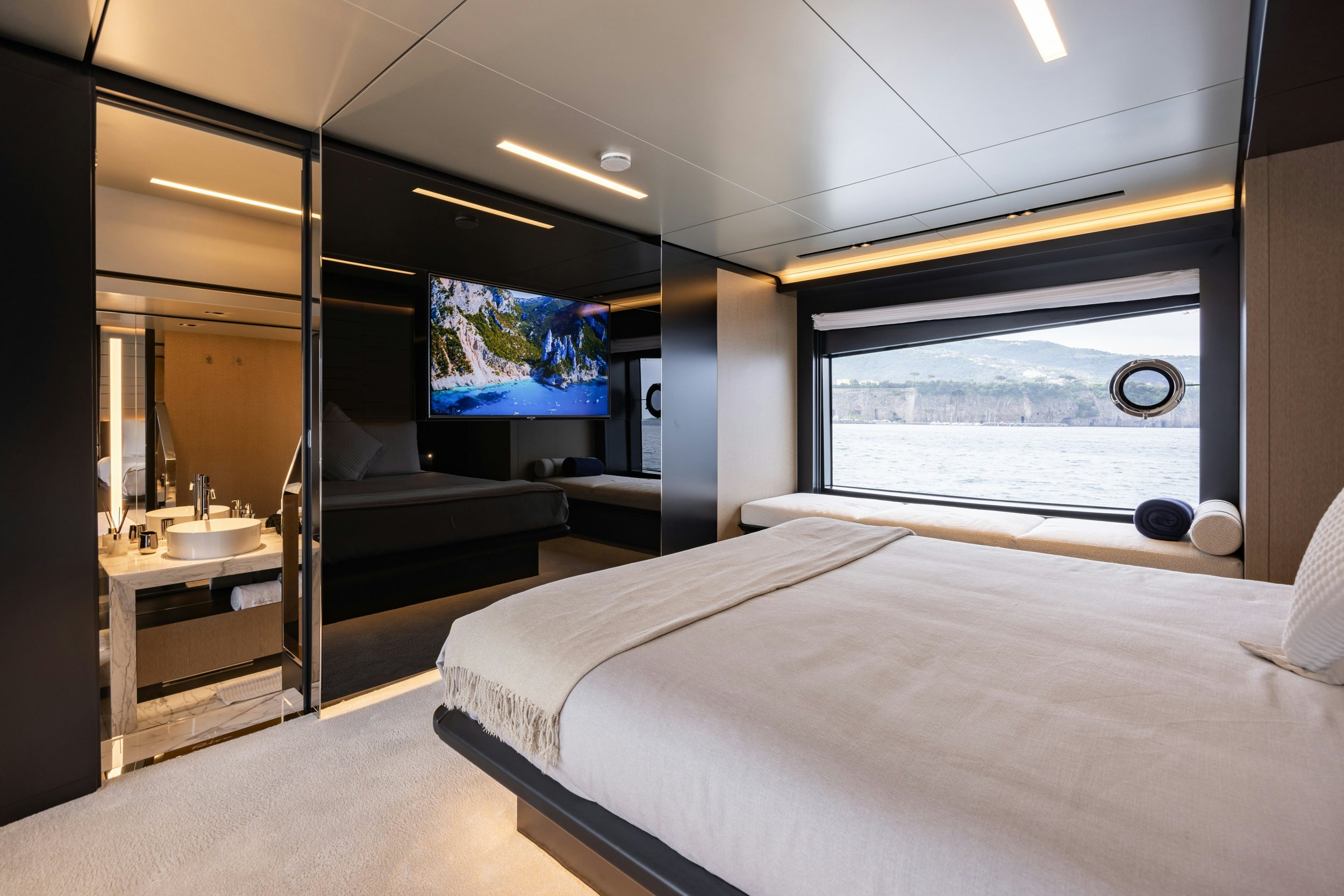 a room with a bed and a window aboard STILE DI VITA Yacht for Sale