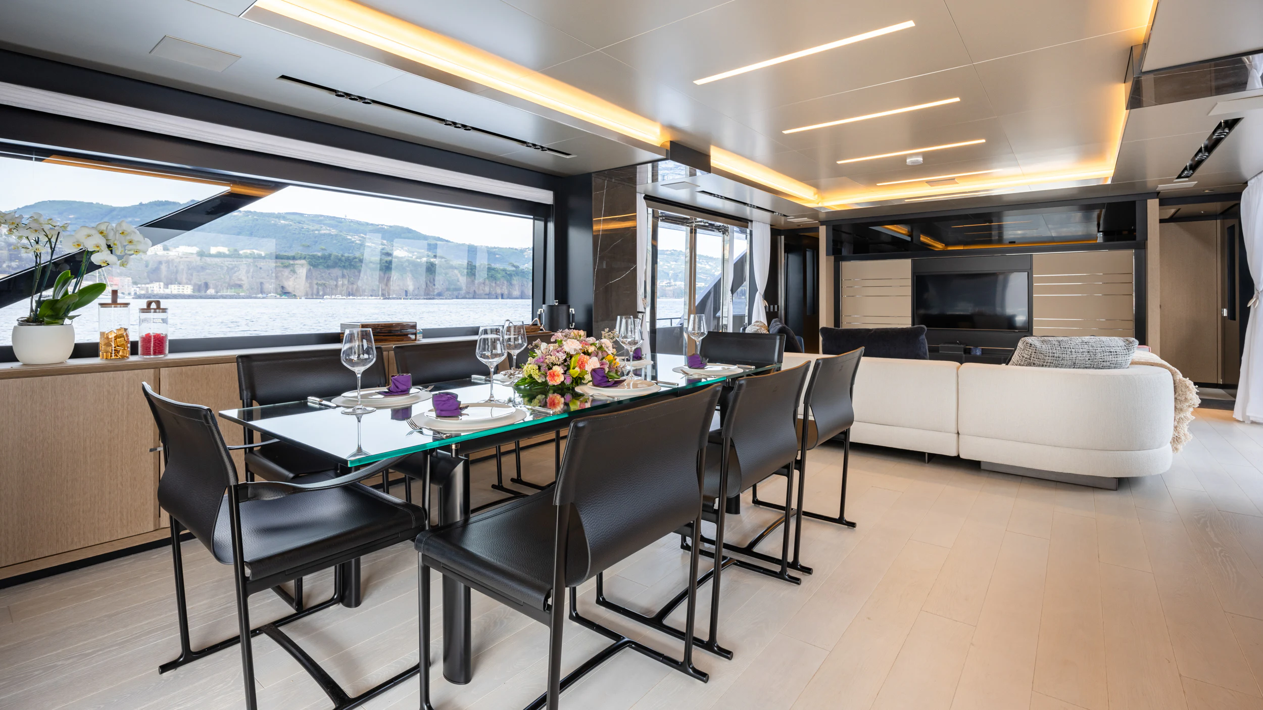 a room with a table and chairs aboard STILE DI VITA Yacht for Charter