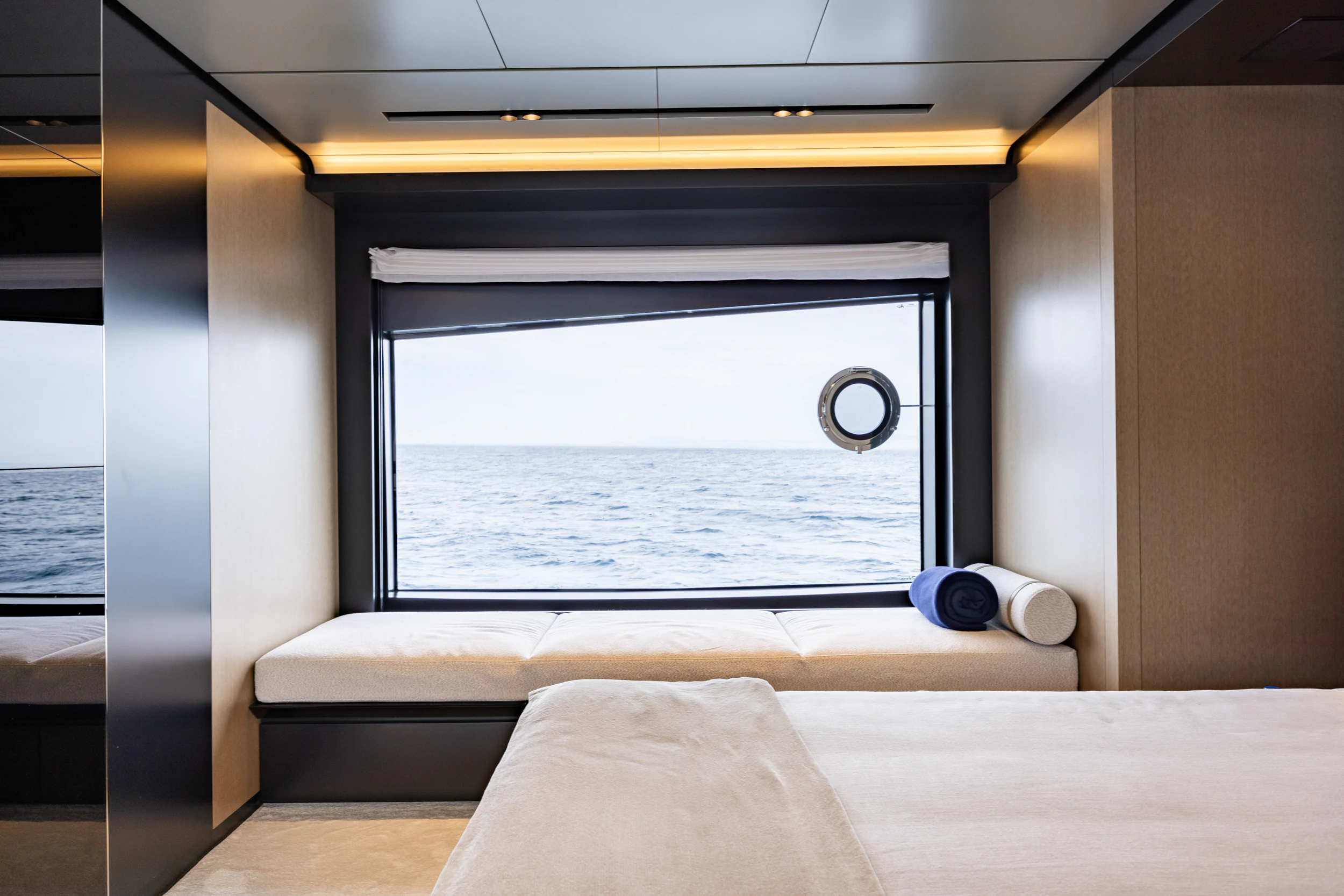 a room with a bed and a window aboard STILE DI VITA Yacht for Charter
