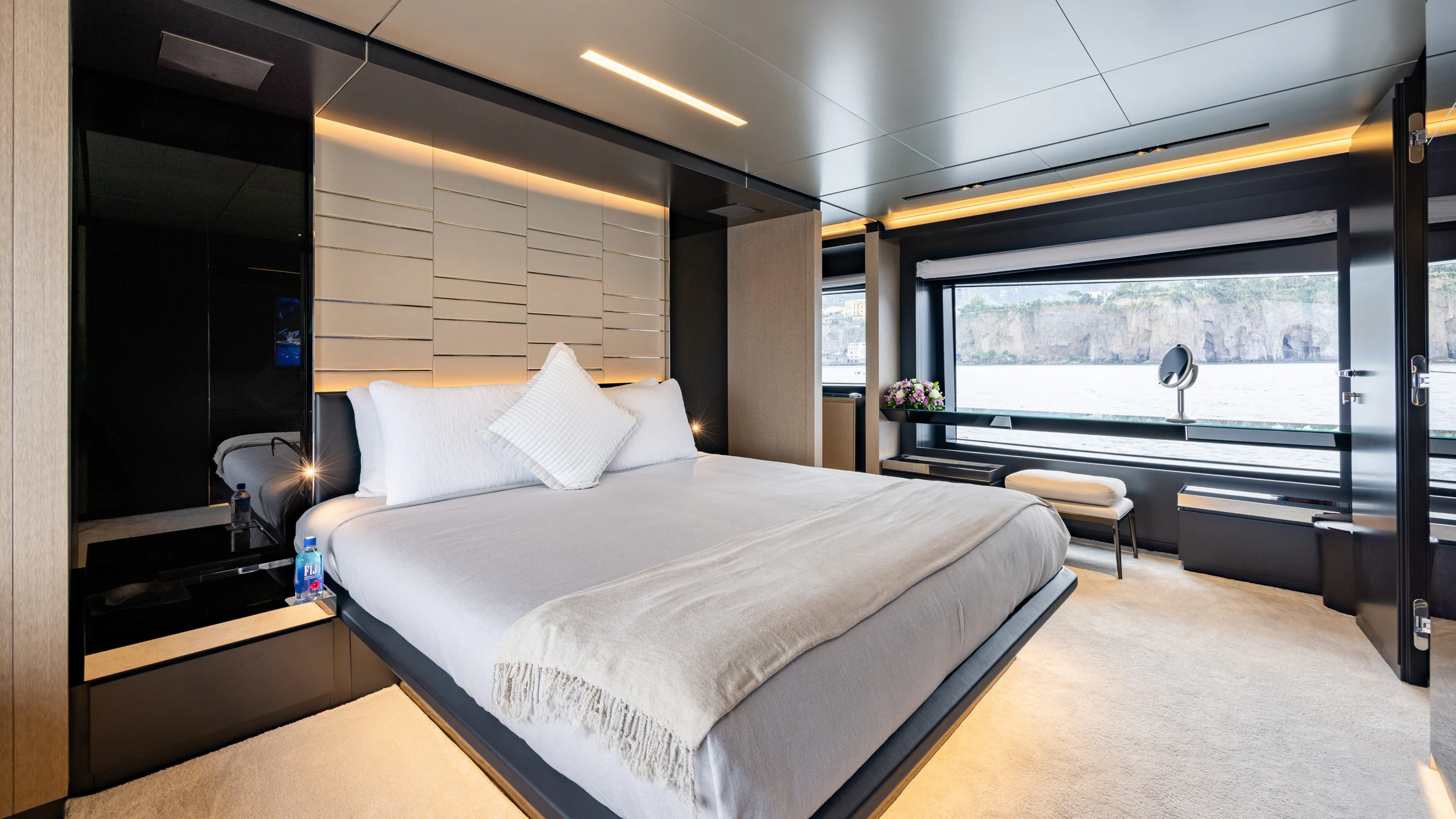 a room with a bed and a window aboard STILE DI VITA Yacht for Charter
