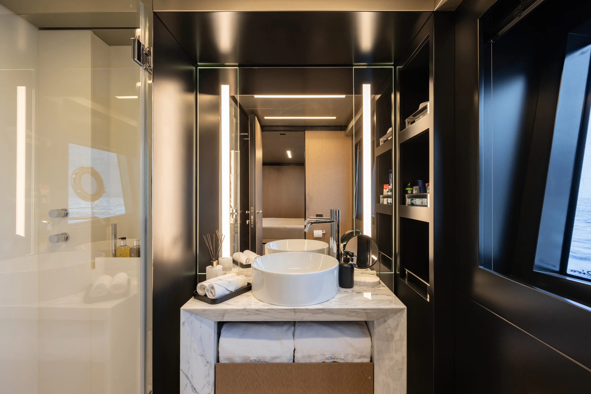 a bathroom with a sink and a mirror aboard STILE DI VITA Yacht for Charter