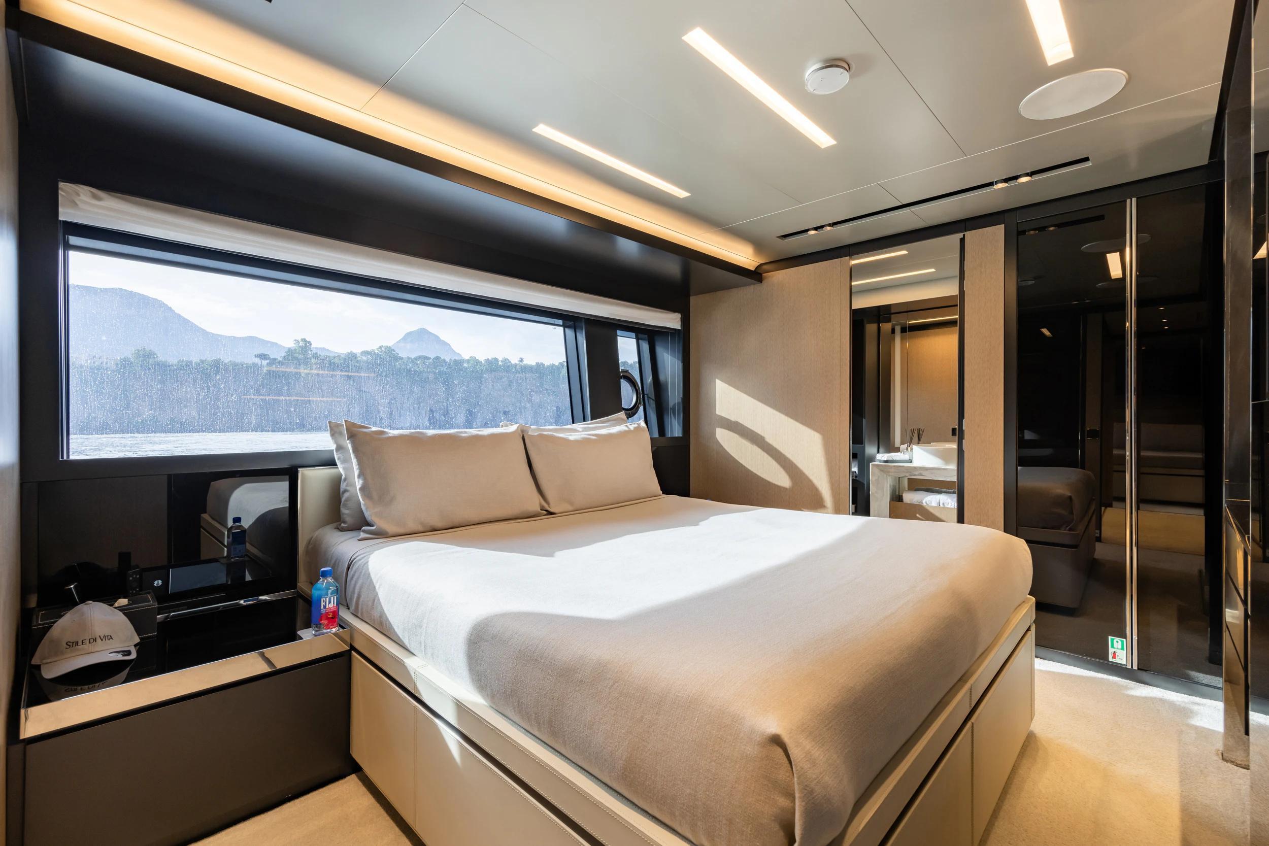 a room with a bed and a window aboard STILE DI VITA Yacht for Charter