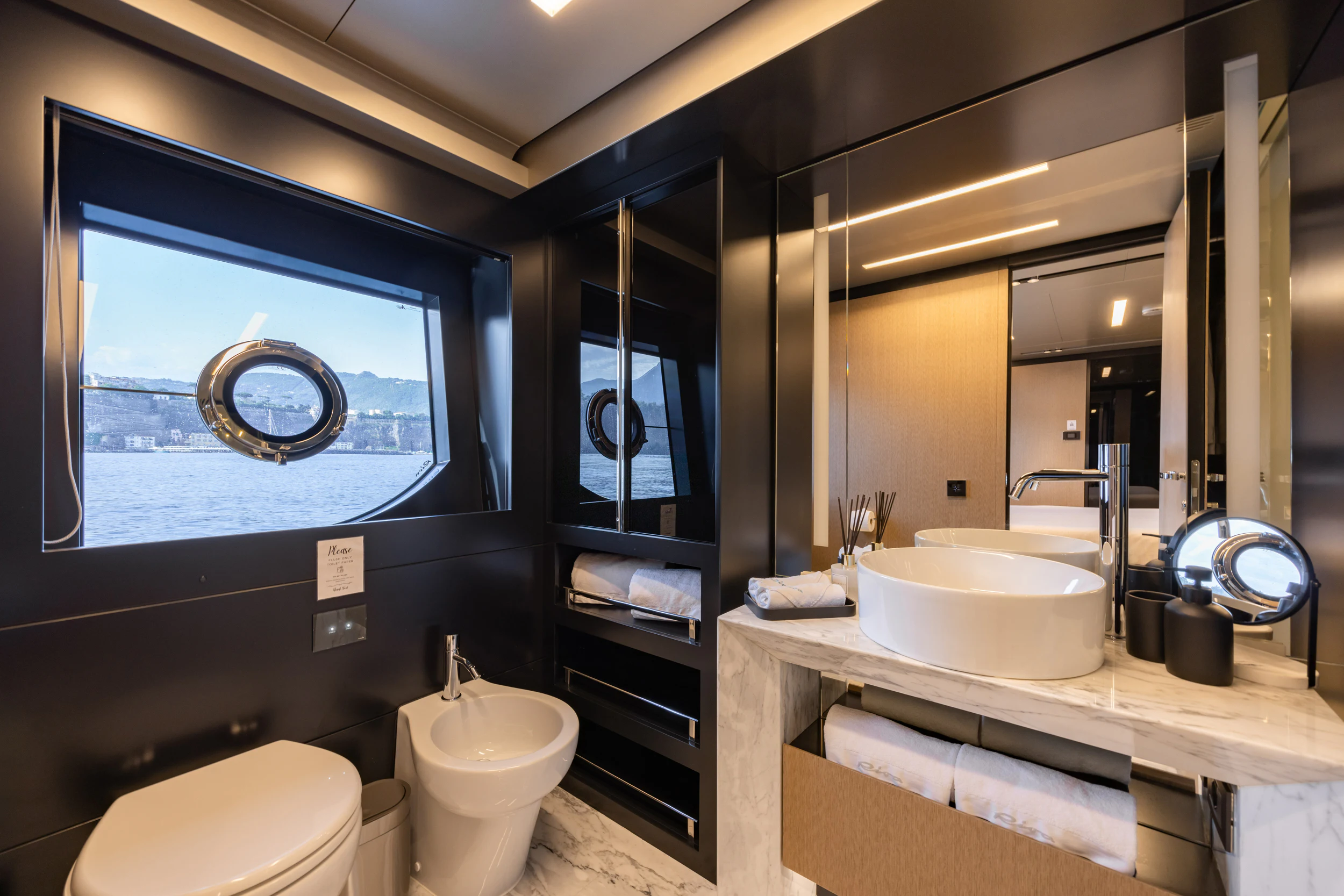 a bathroom with a large mirror aboard STILE DI VITA Yacht for Charter