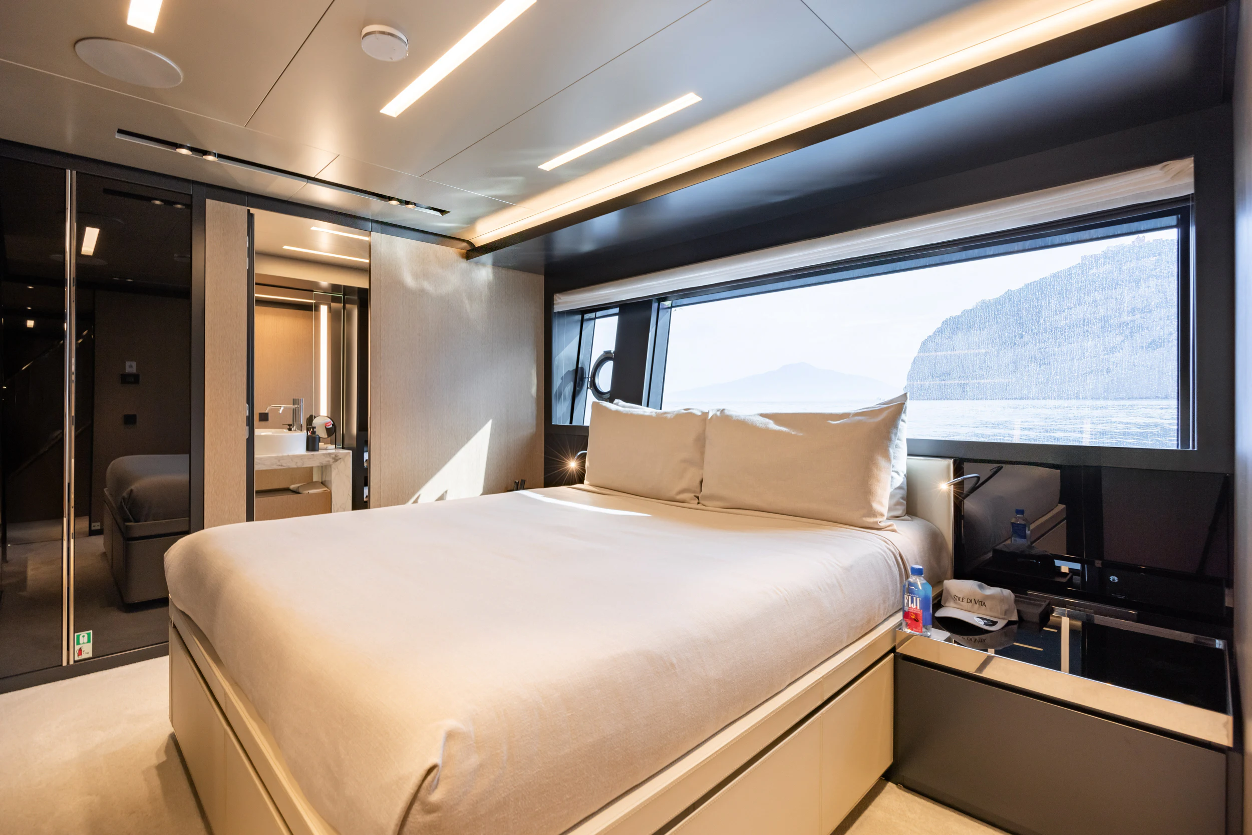 a room with a bed and a window aboard STILE DI VITA Yacht for Charter