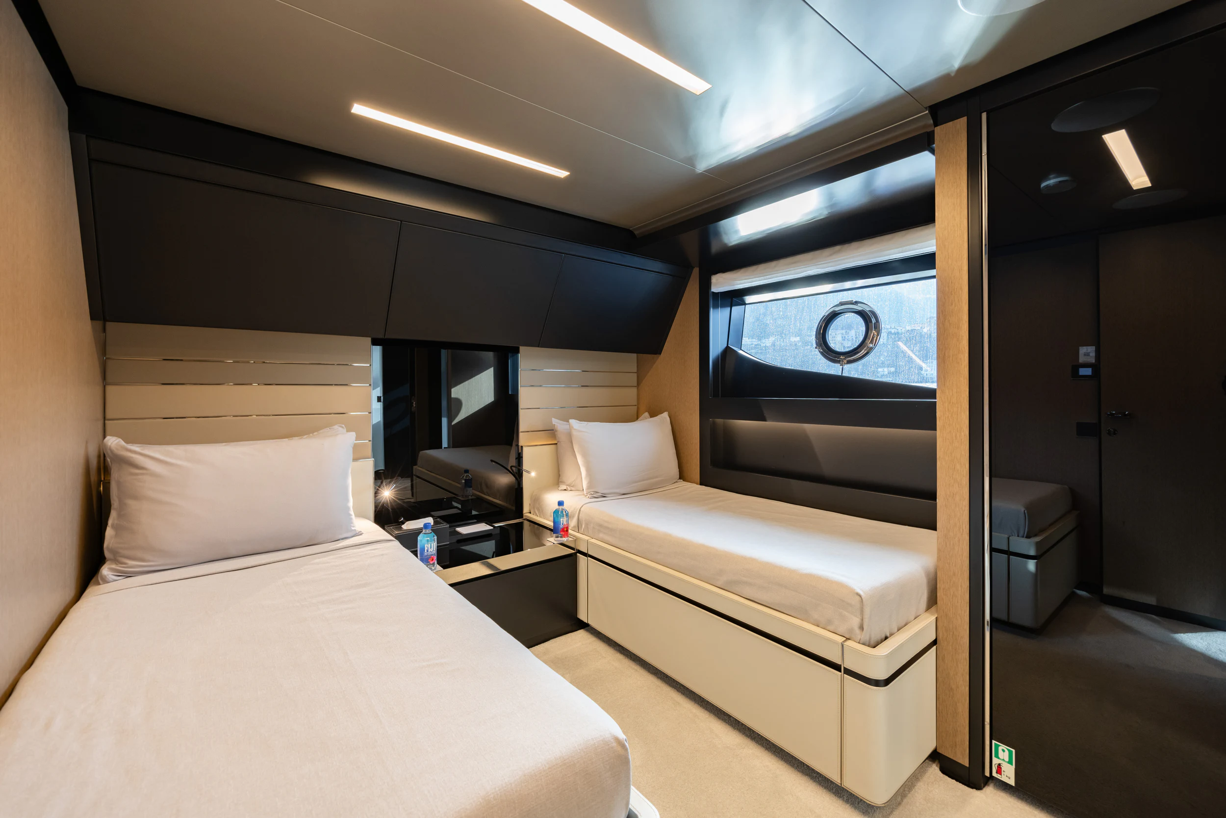 a room with a bed and a mirror aboard STILE DI VITA Yacht for Charter