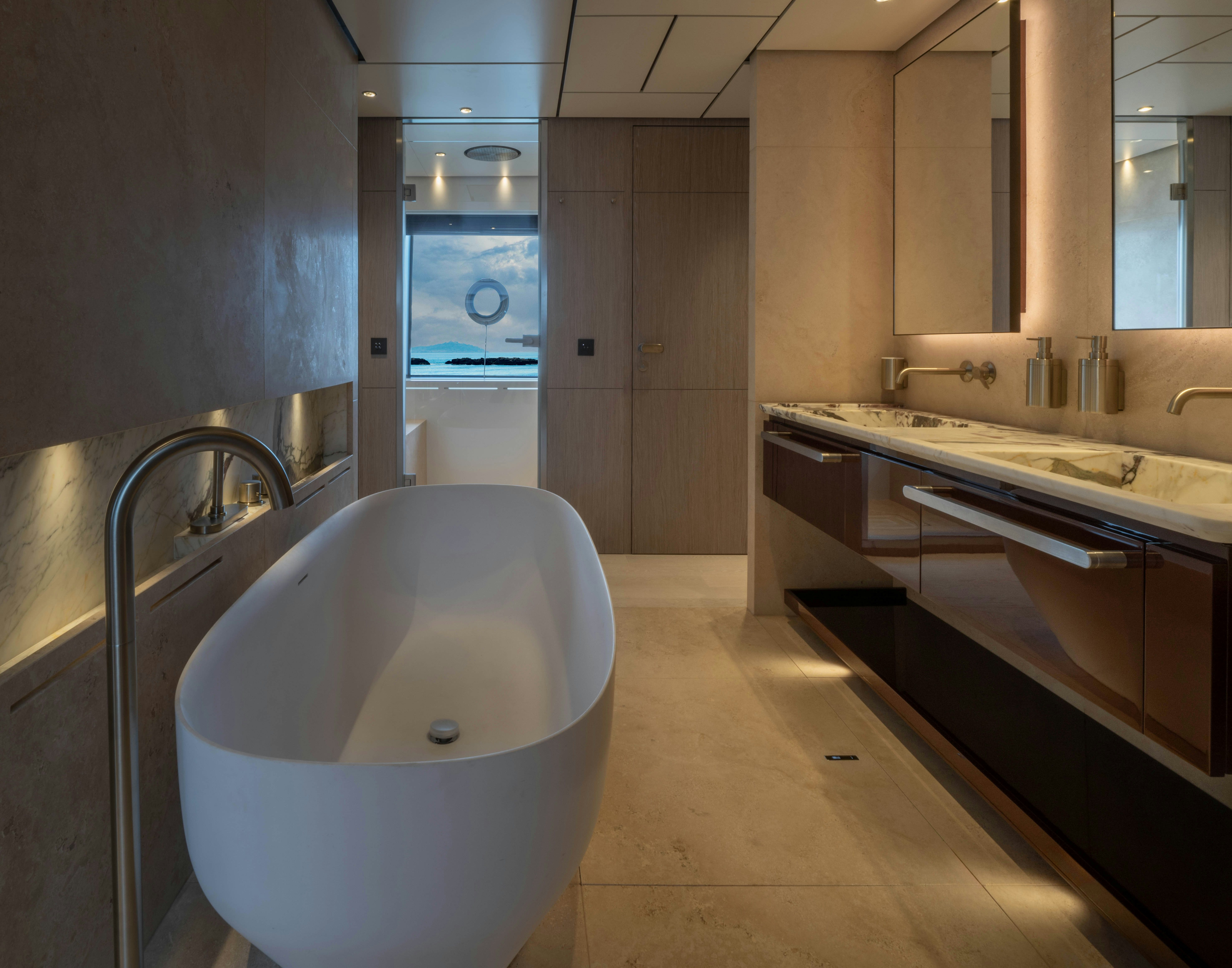 a bathroom with a large bathtub aboard CANOE CANOE Yacht for Charter