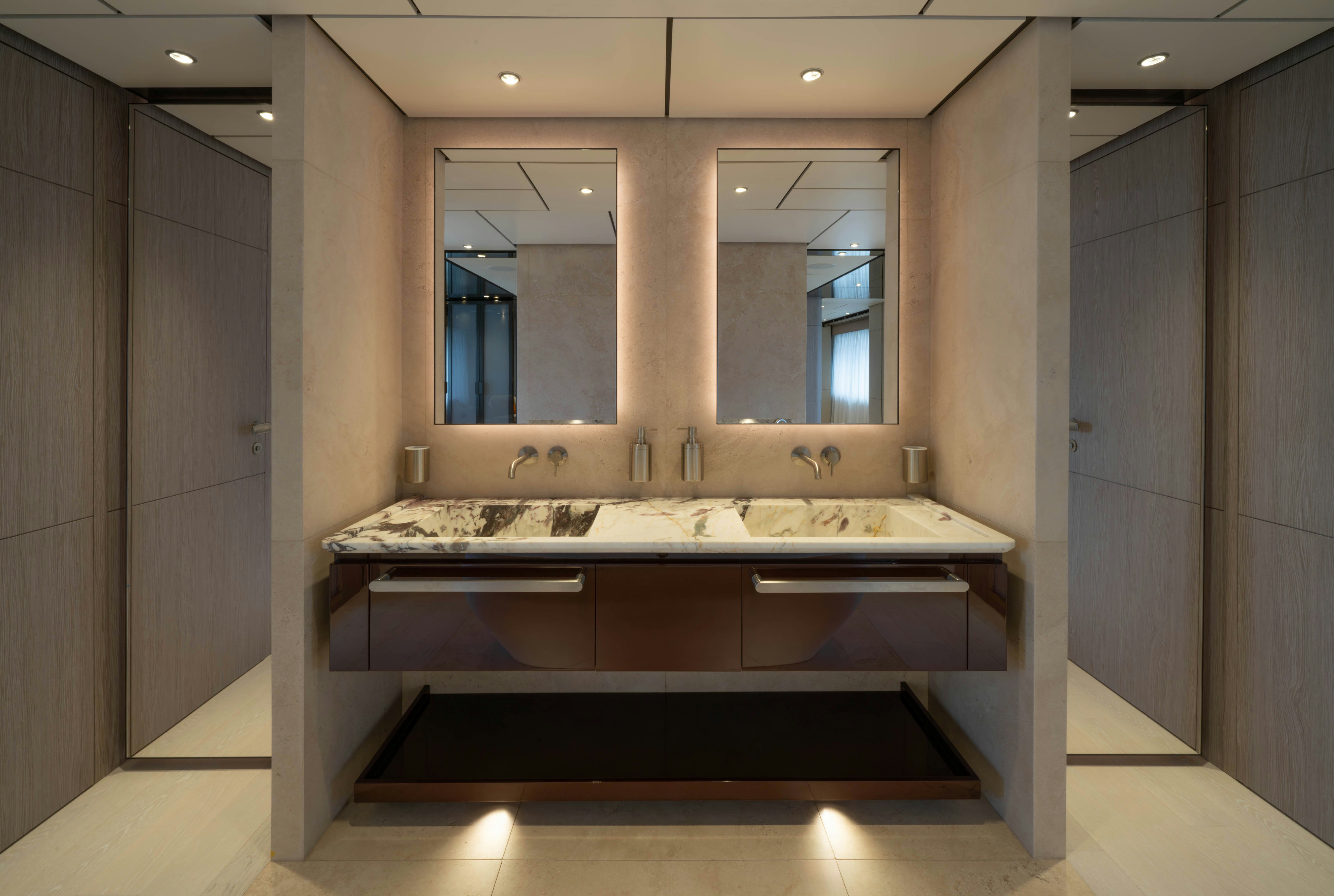 a bathroom with a large mirror aboard CANOE CANOE Yacht for Charter