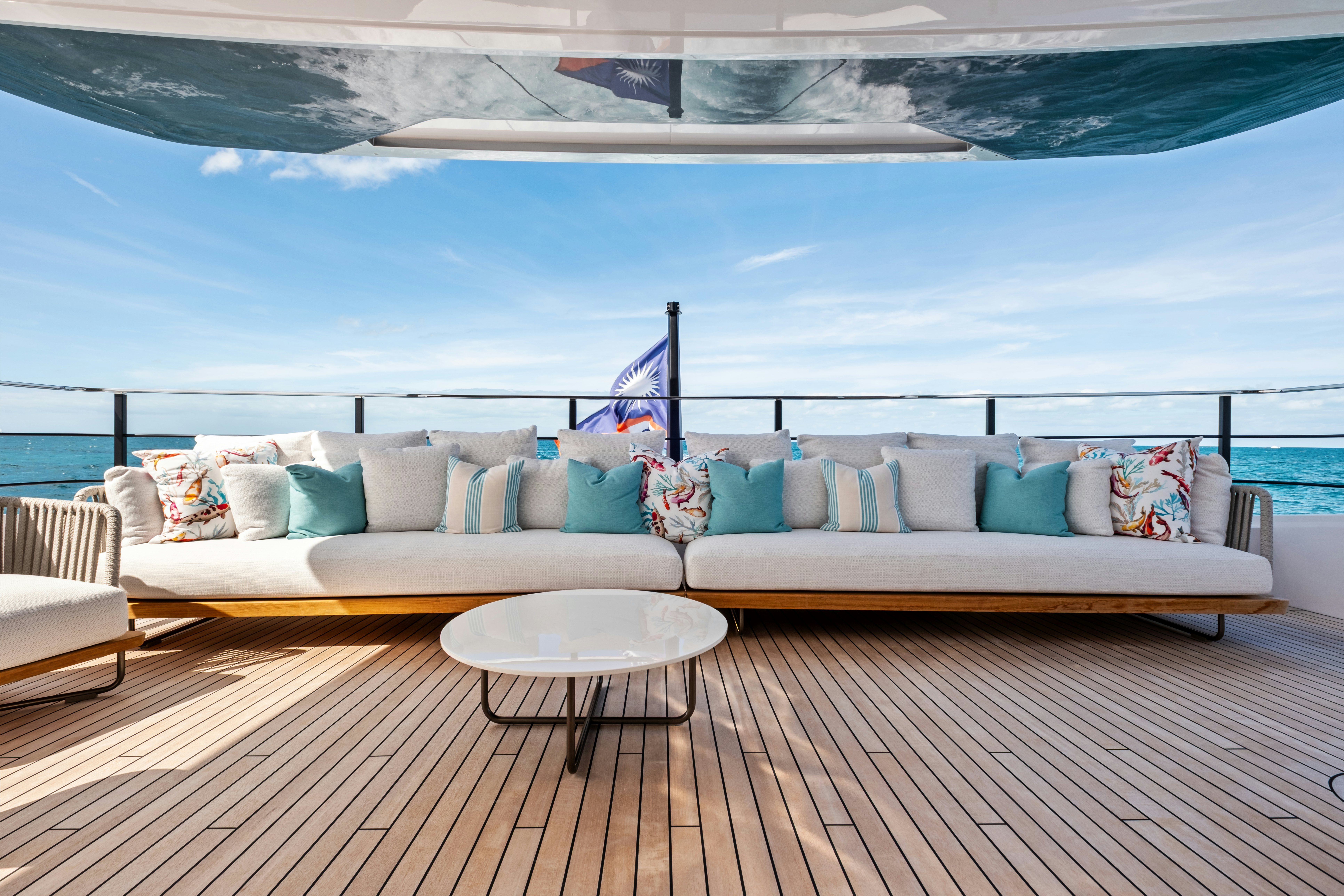 a large bed with a table on it aboard CANOE CANOE Yacht for Charter