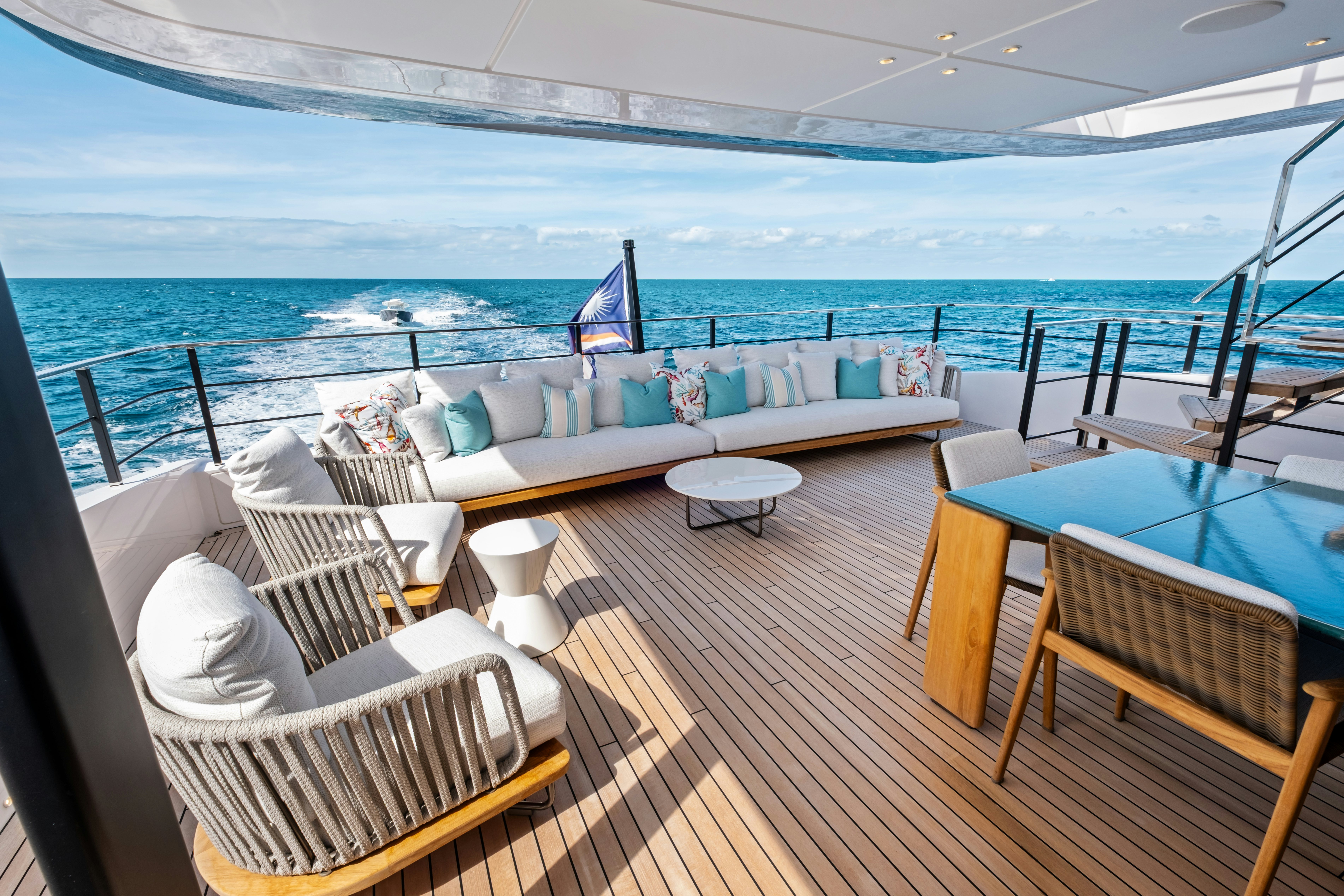 a deck with a view of the ocean and the ocean aboard CANOE CANOE Yacht for Charter