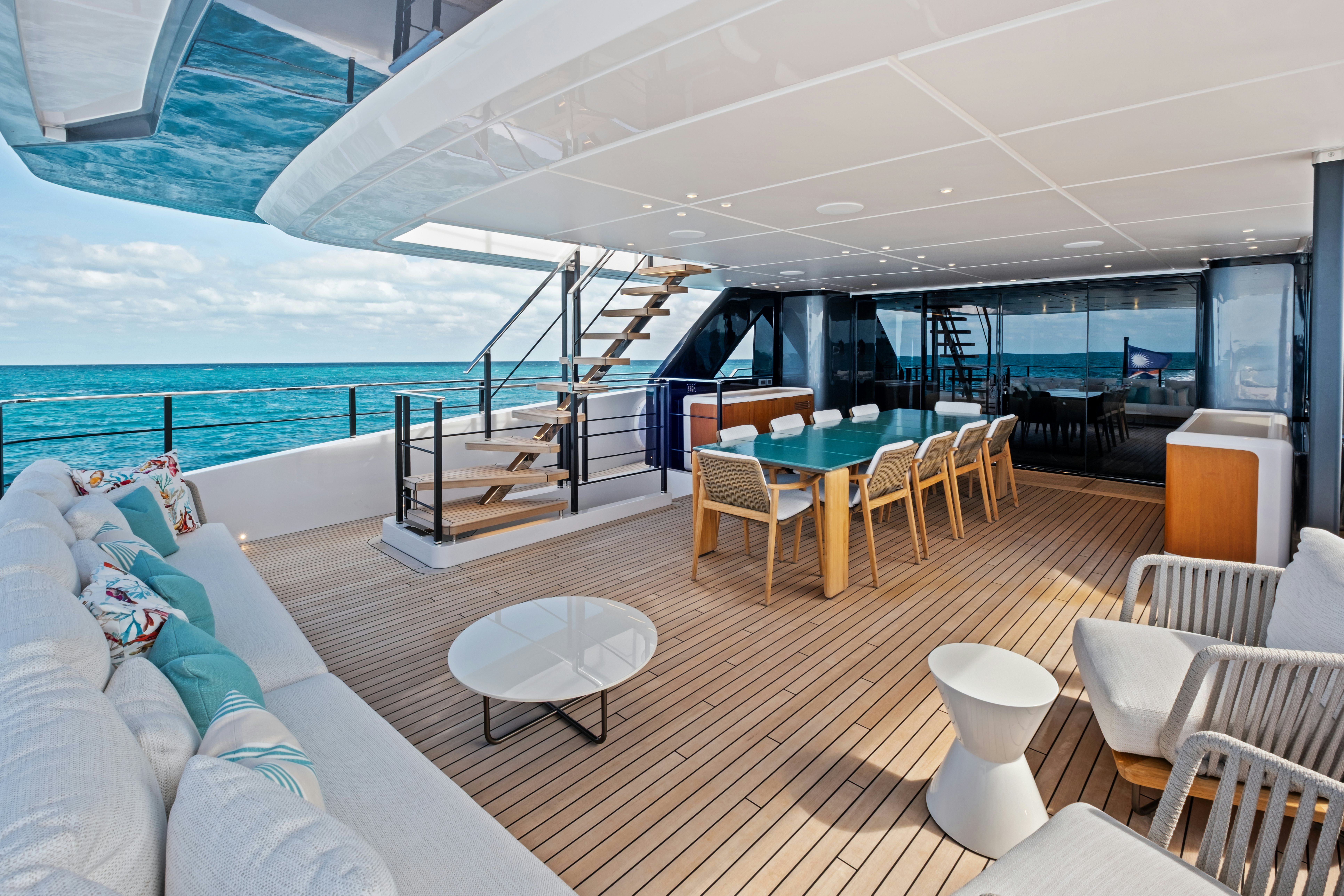 a room with a large balcony aboard CANOE CANOE Yacht for Charter