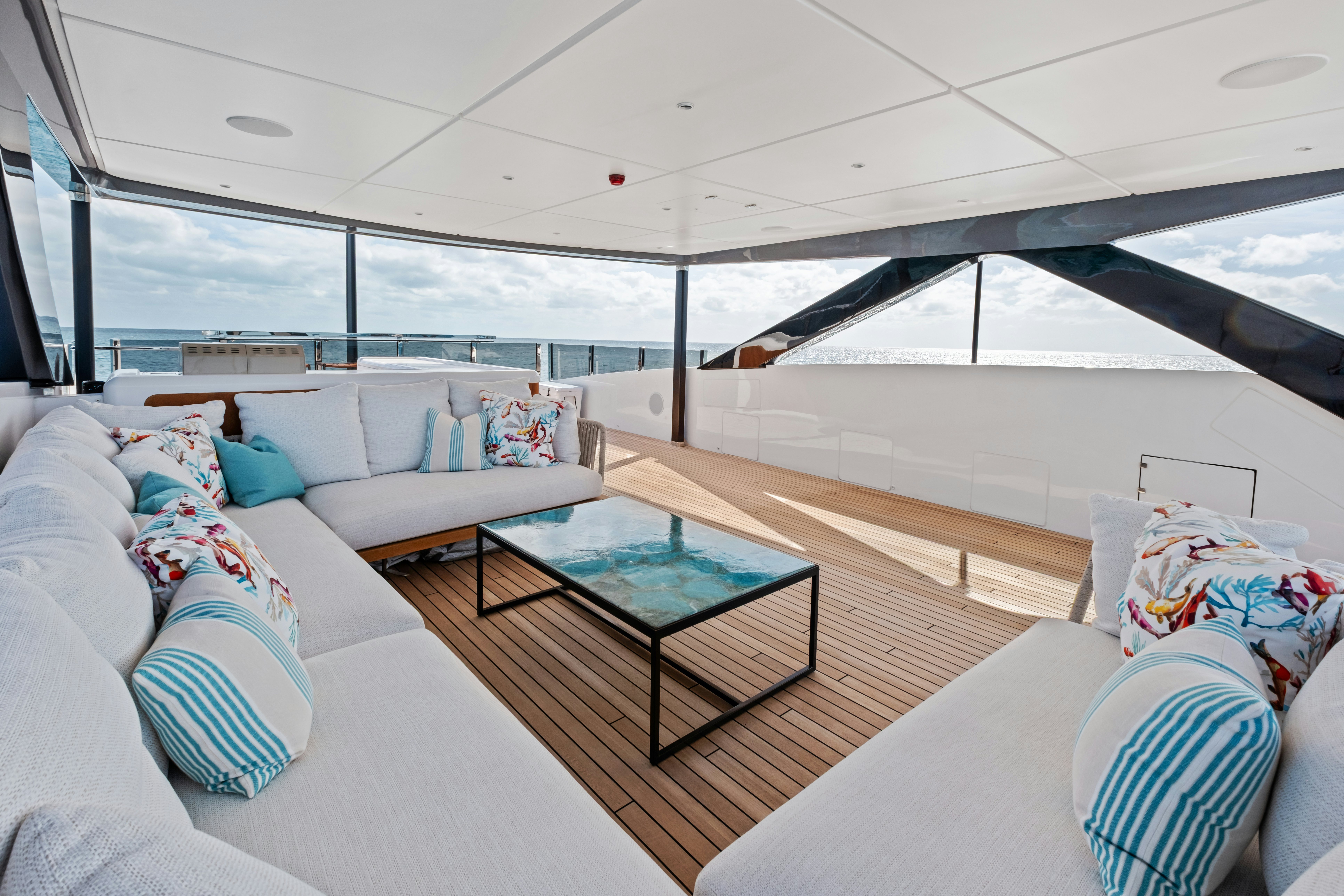 a modern living room with a large glass ceiling aboard CANOE CANOE Yacht for Charter