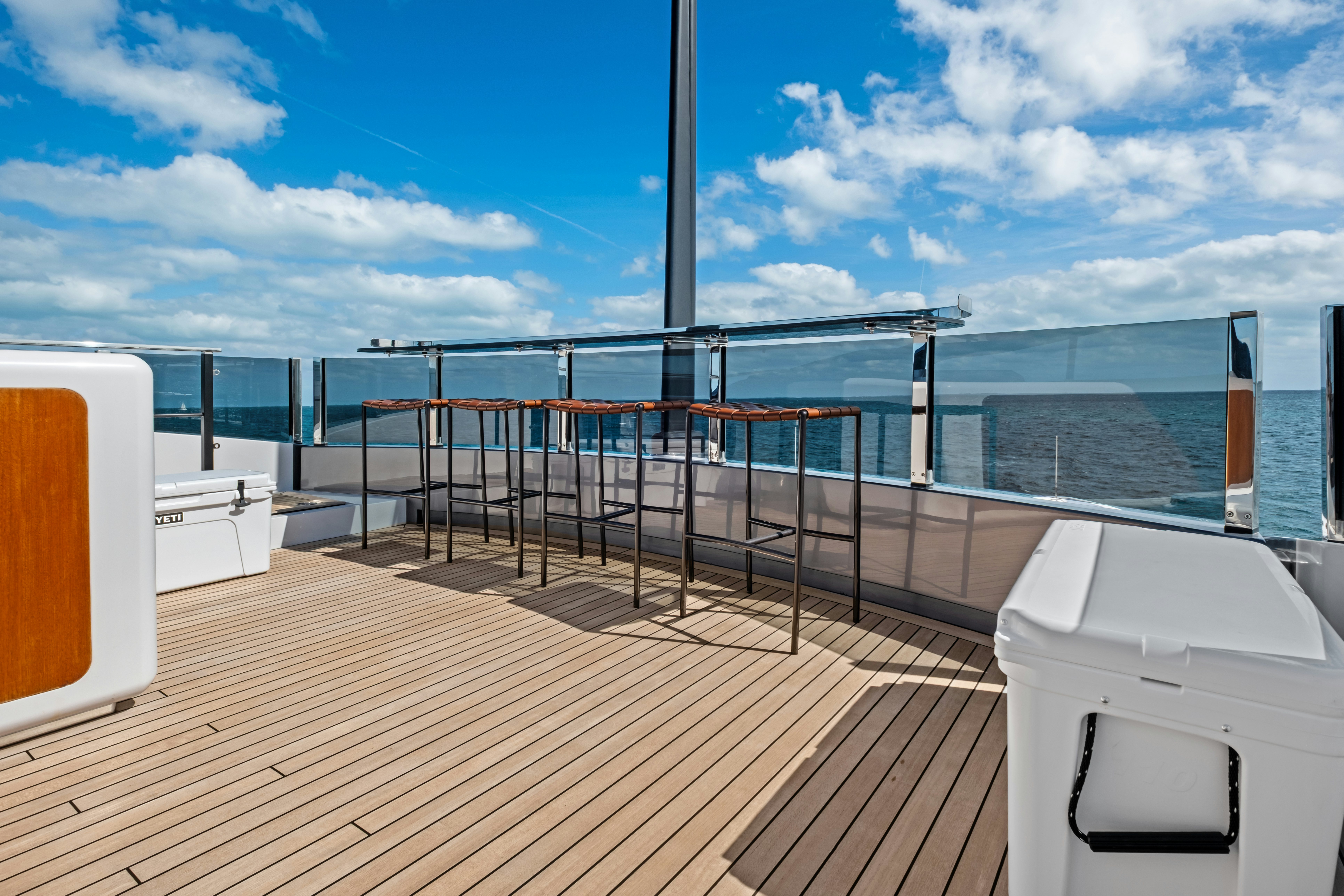 a deck overlooking the ocean aboard CANOE CANOE Yacht for Charter