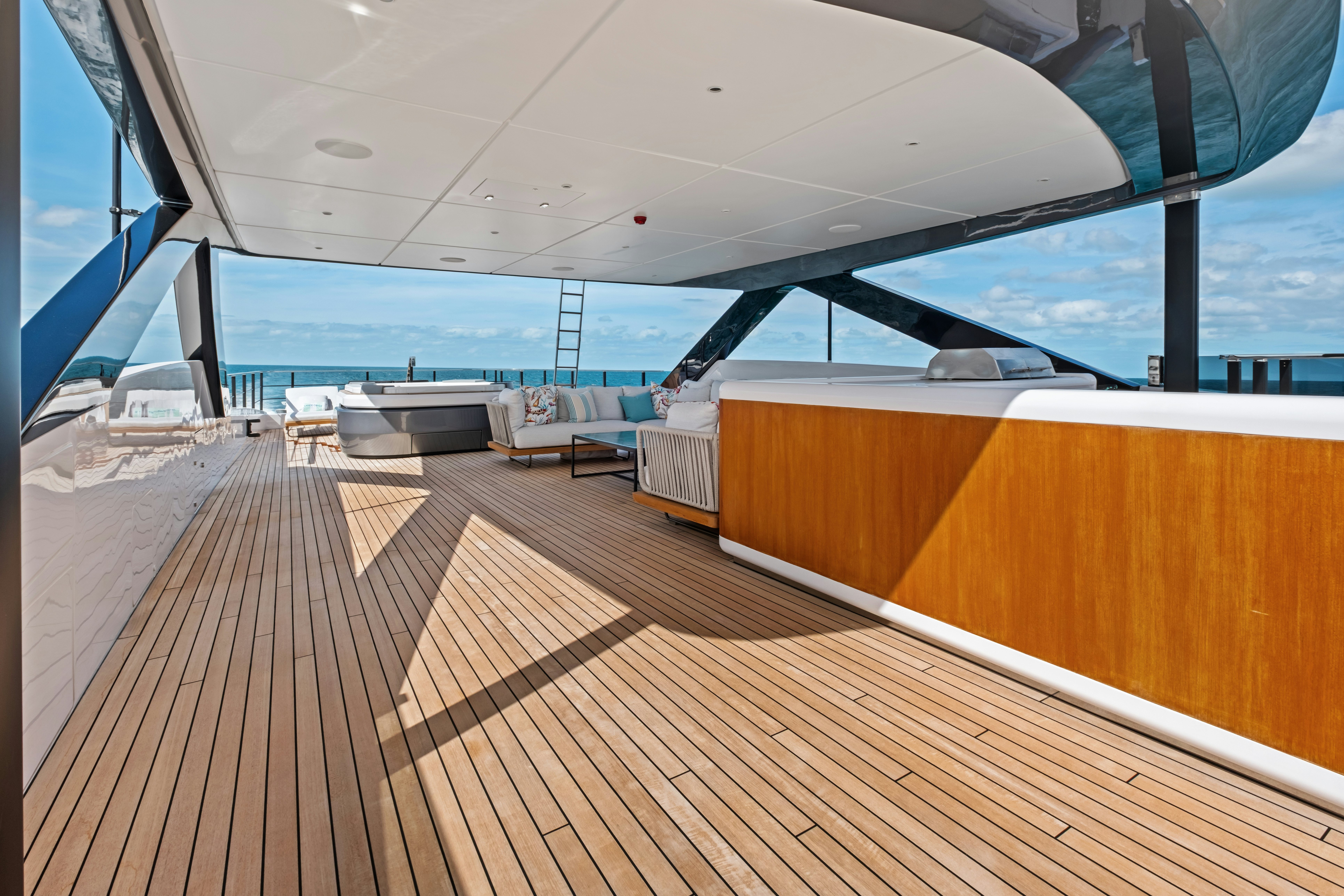 a deck with a view of the ocean and the deck aboard CANOE CANOE Yacht for Charter