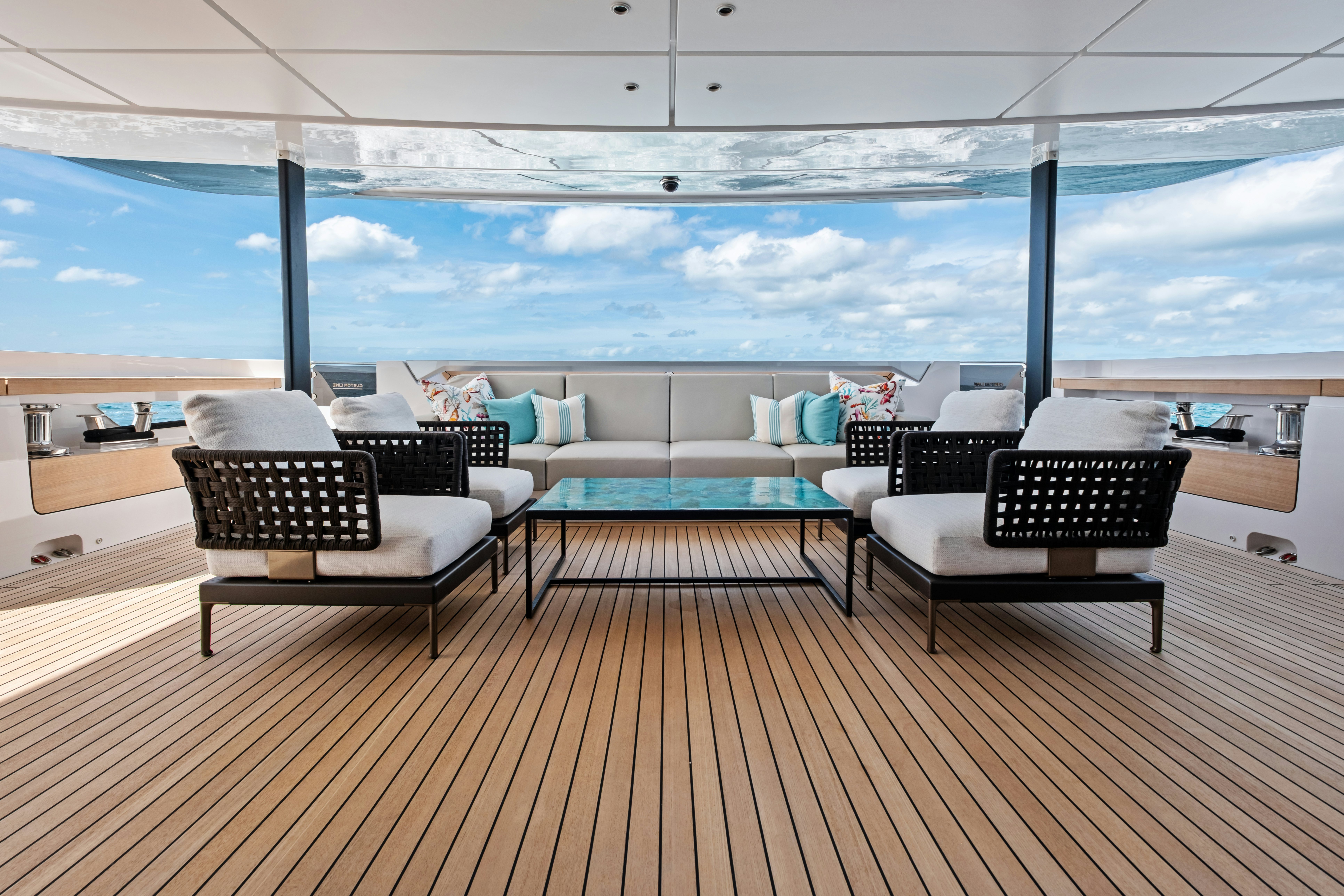 a deck with a view of the ocean aboard CANOE CANOE Yacht for Charter