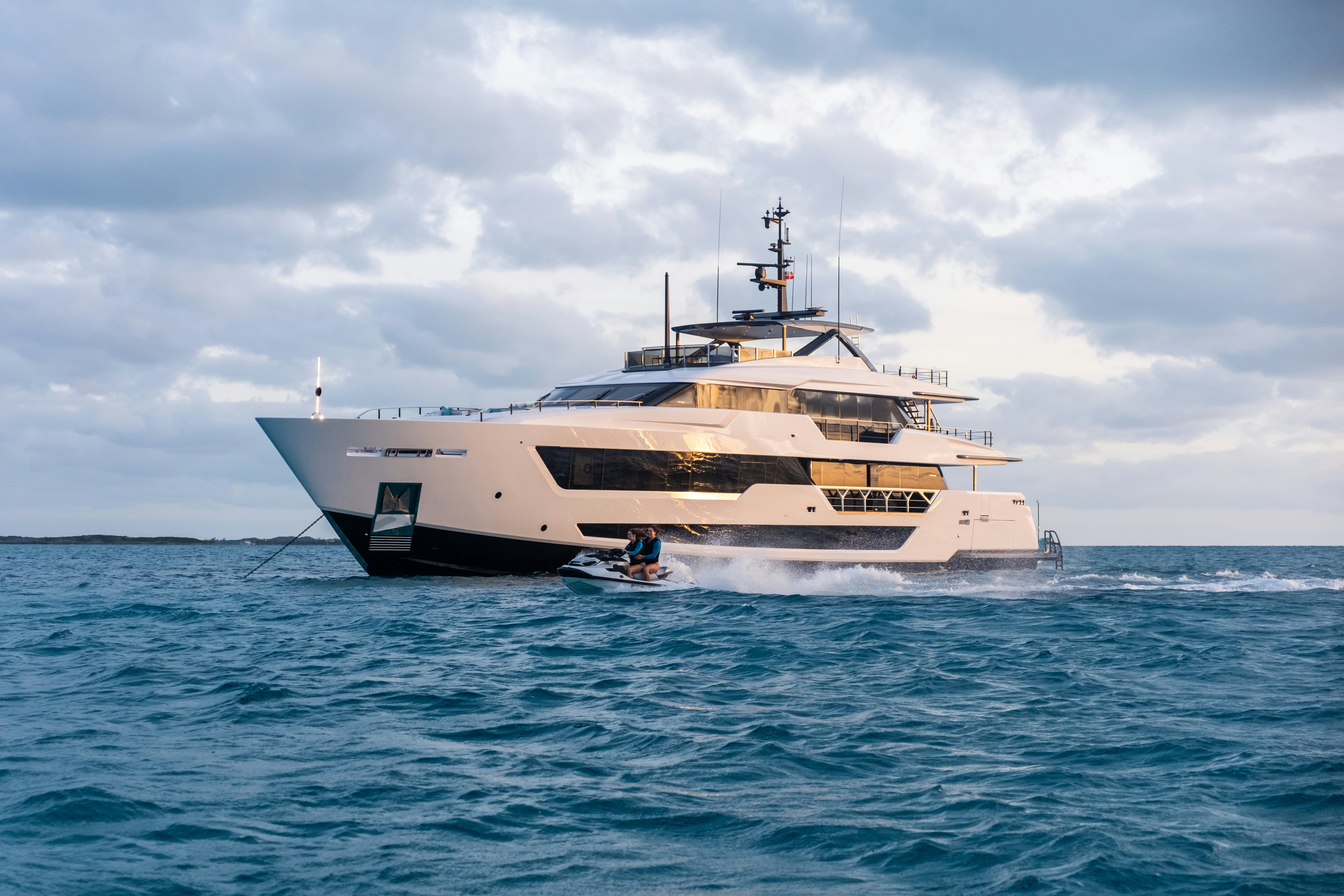 a large white ship in the water aboard CANOE CANOE Yacht for Charter