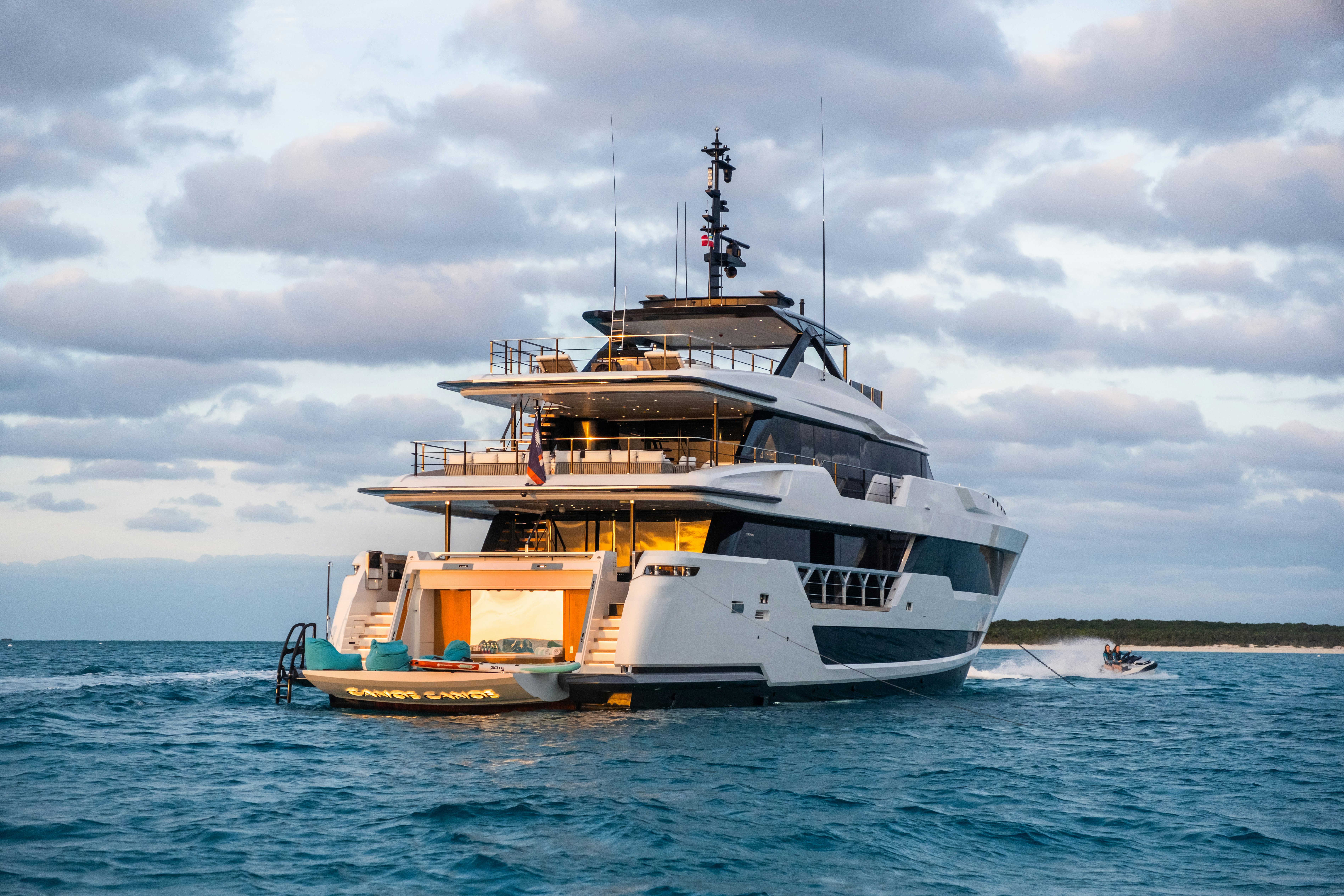 a large white boat in the water aboard CANOE CANOE Yacht for Charter