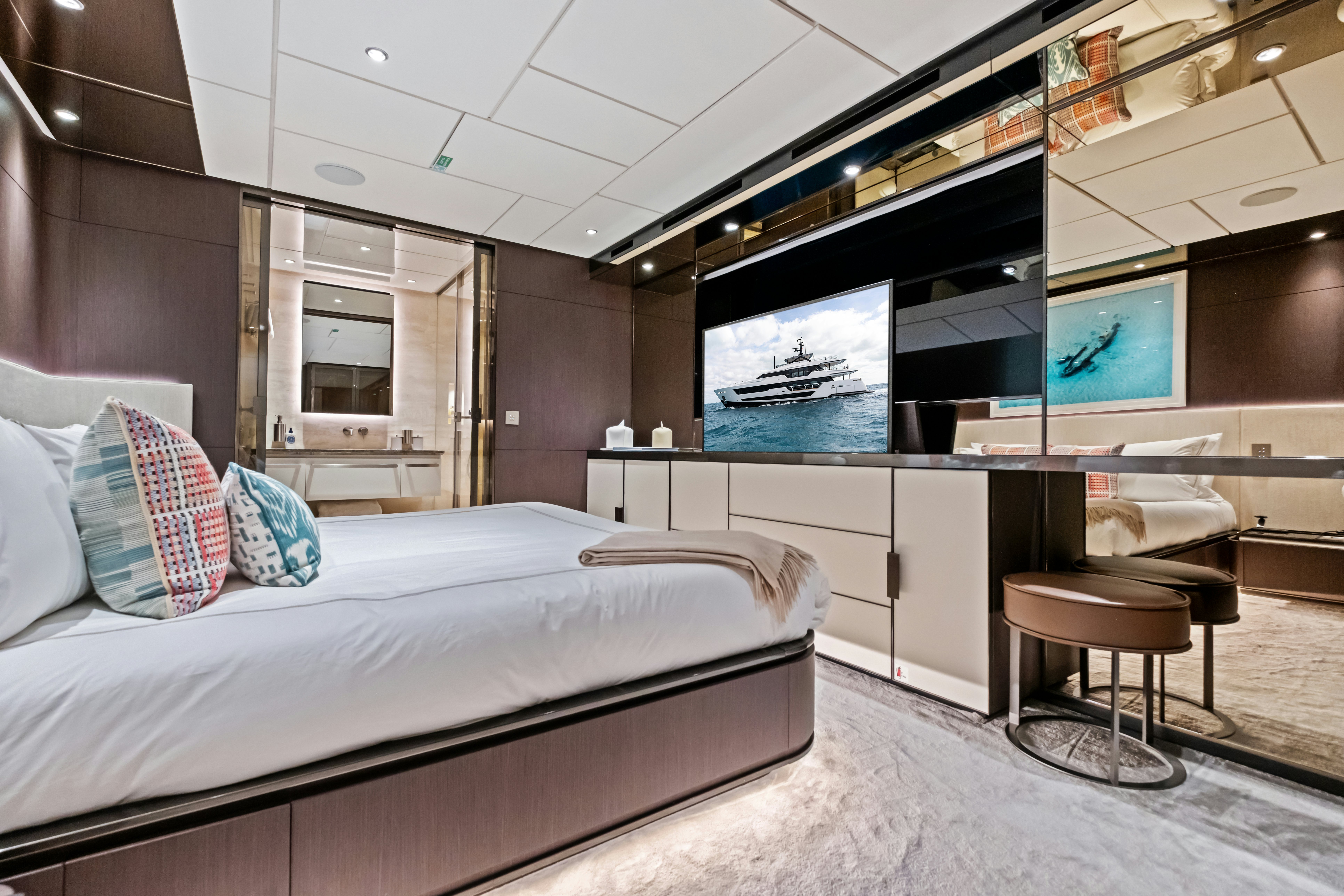 a room with a bed and a tv aboard CANOE CANOE Yacht for Charter