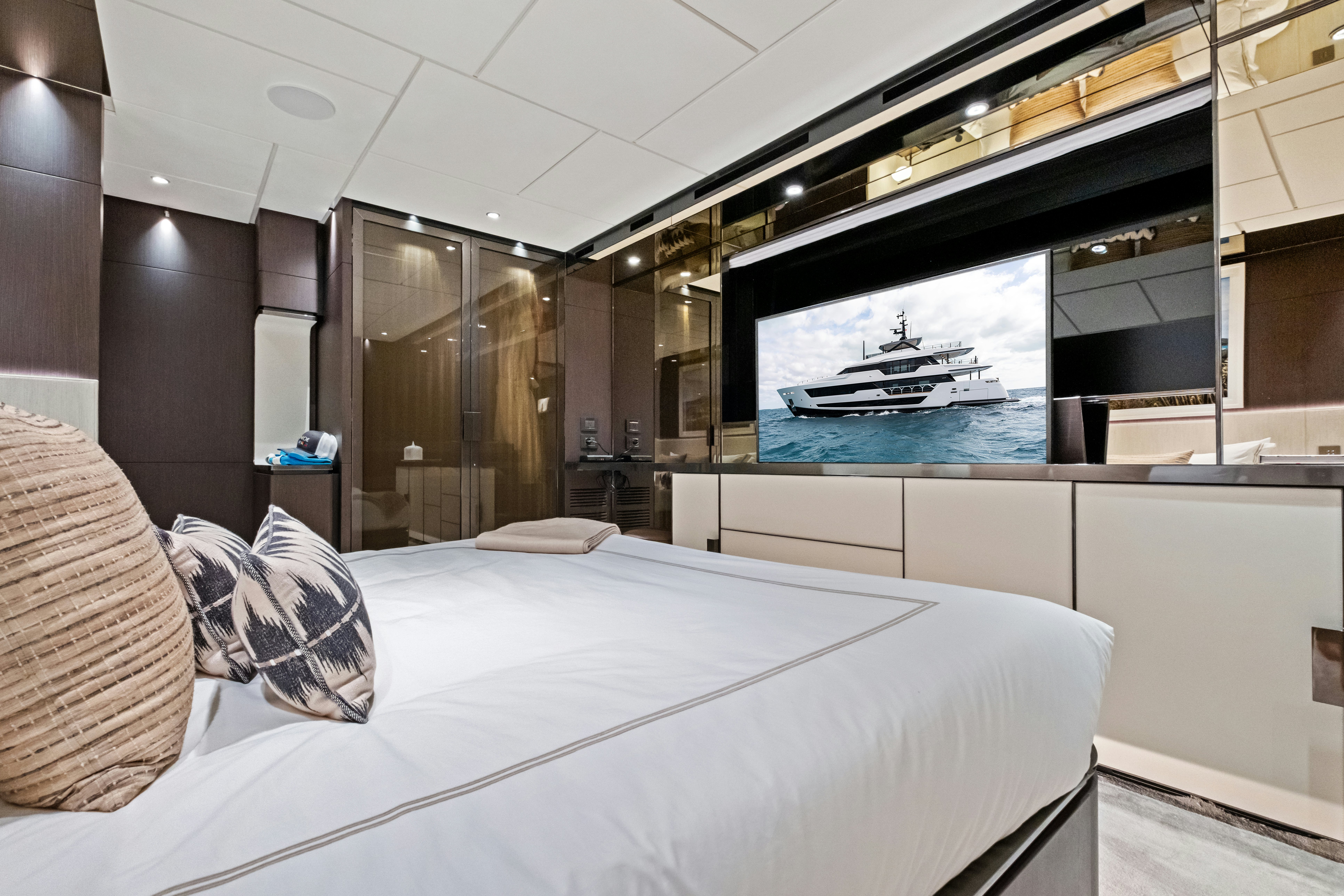 a room with a bed and a tv aboard CANOE CANOE Yacht for Charter