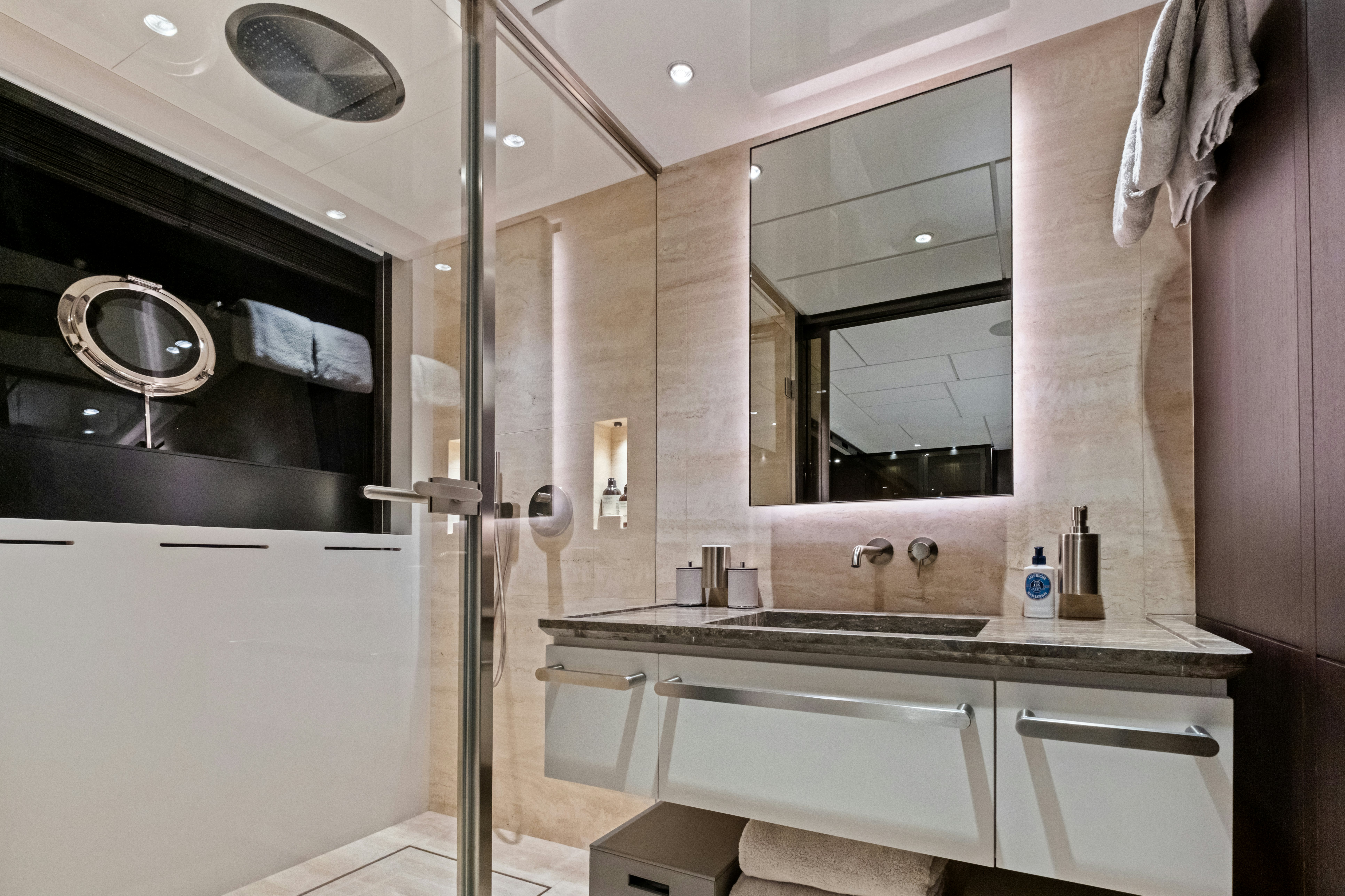 a bathroom with a glass shower aboard CANOE CANOE Yacht for Charter