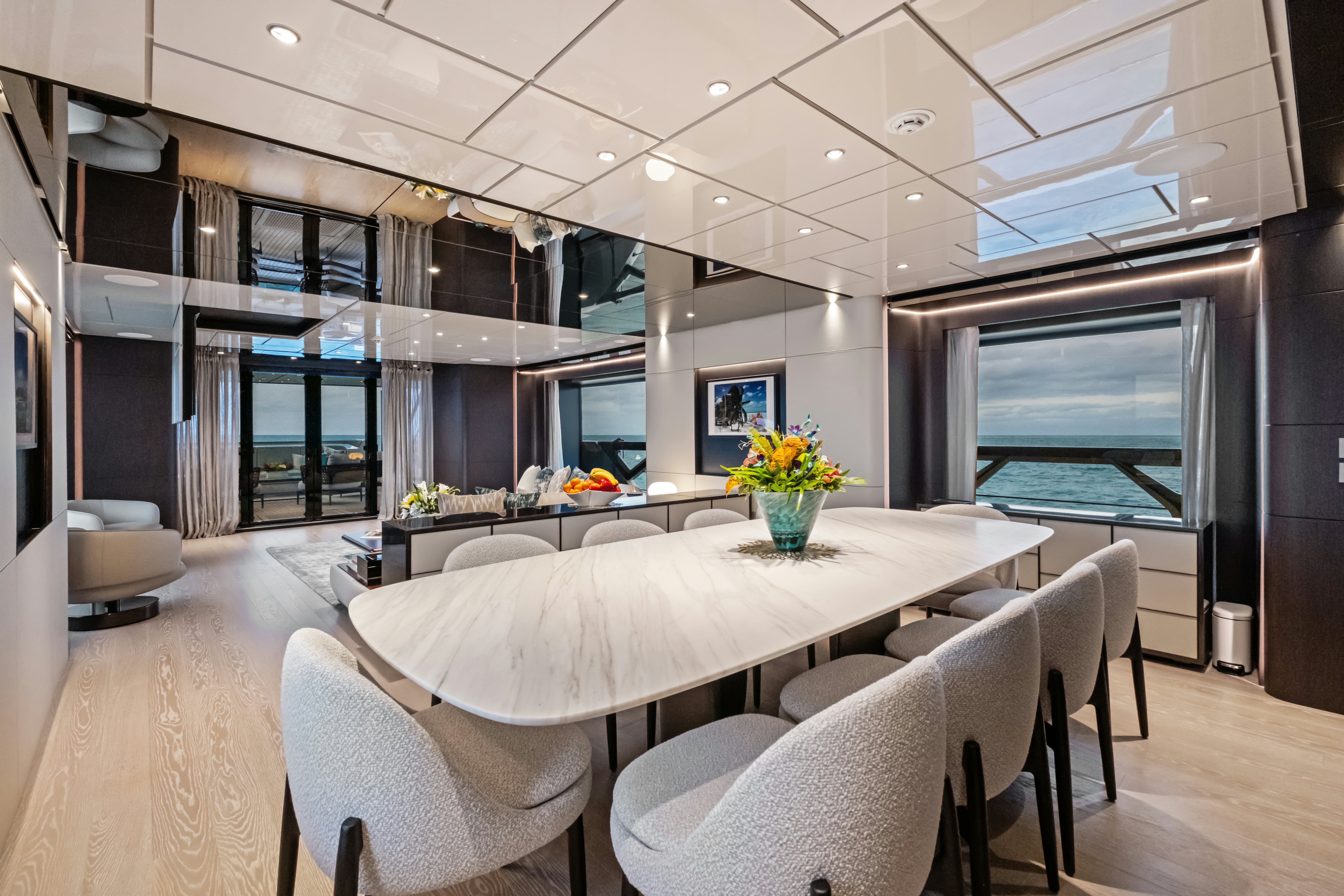 a large room with a table and chairs aboard CANOE CANOE Yacht for Charter