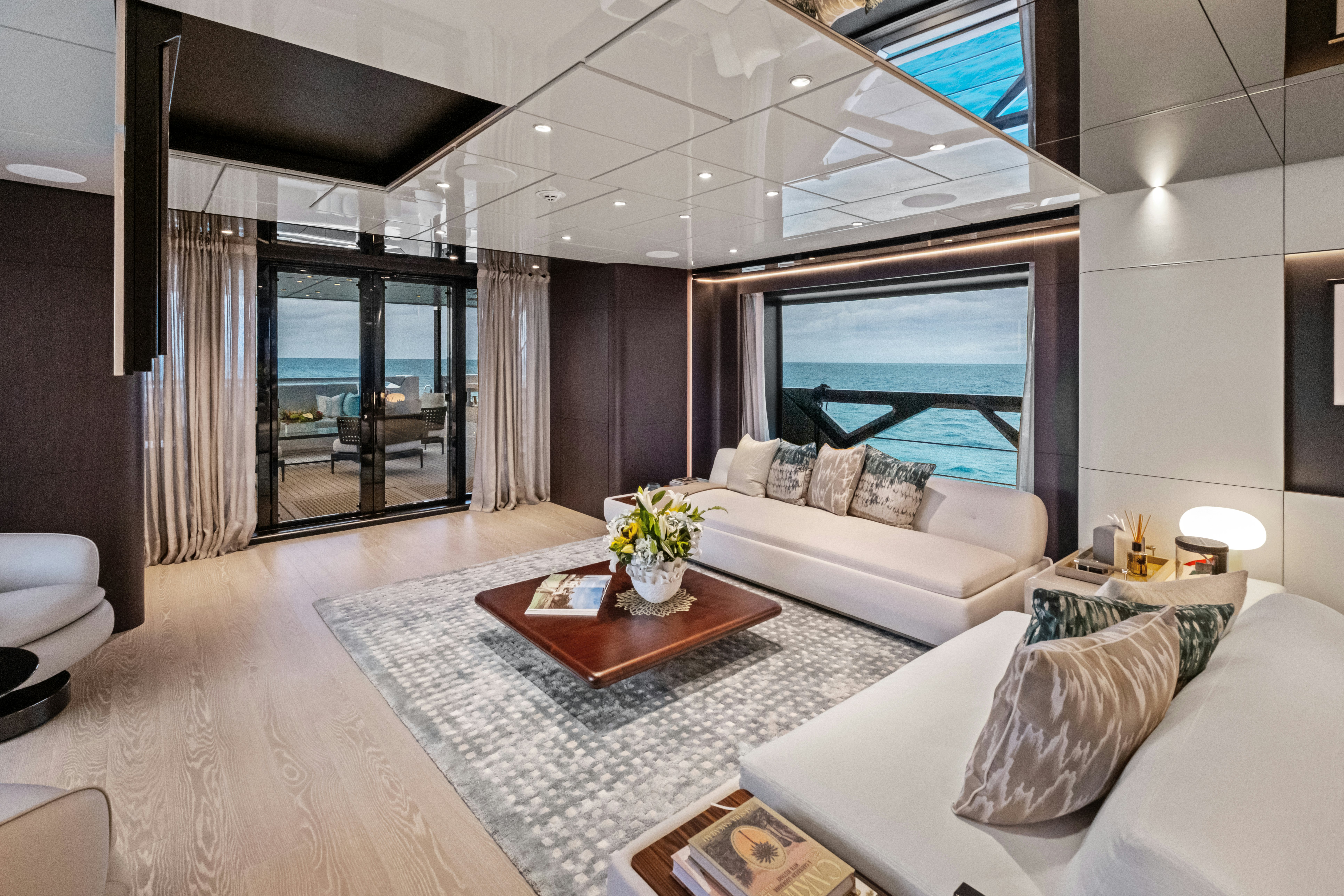 a living room with a fireplace aboard CANOE CANOE Yacht for Charter