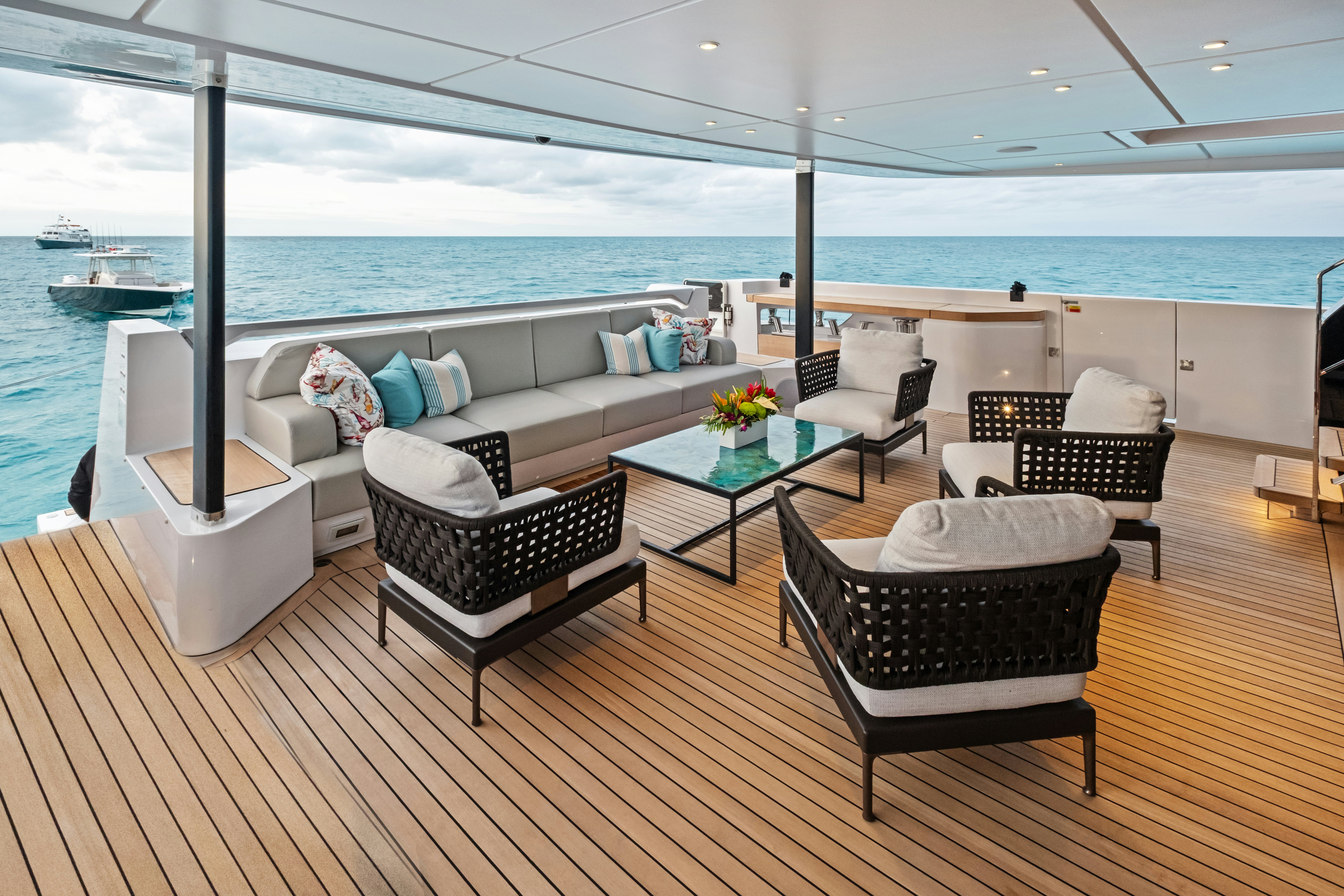 a living room with a large balcony overlooking the ocean aboard CANOE CANOE Yacht for Charter