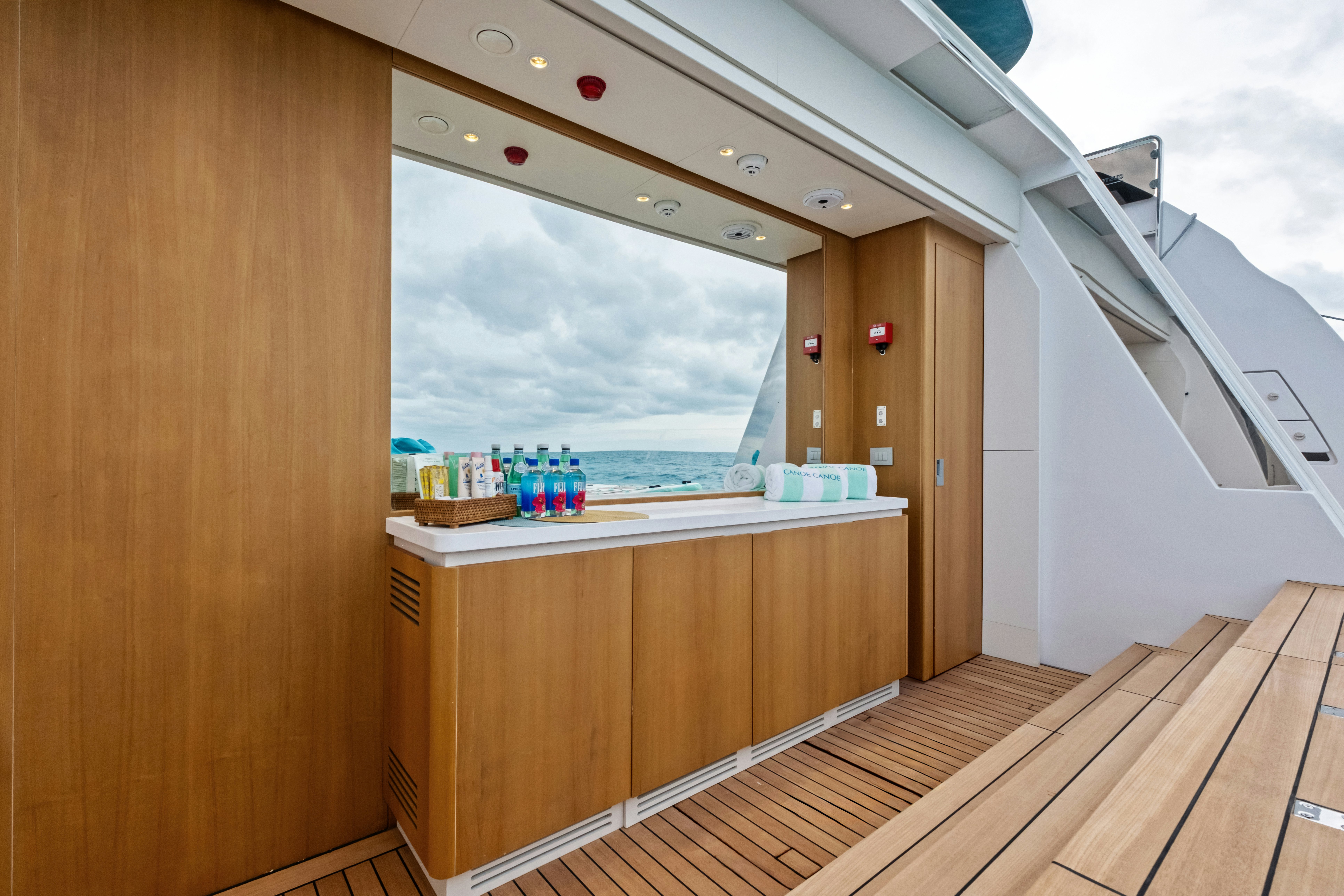 a room with a large window and a wood floor aboard CANOE CANOE Yacht for Charter